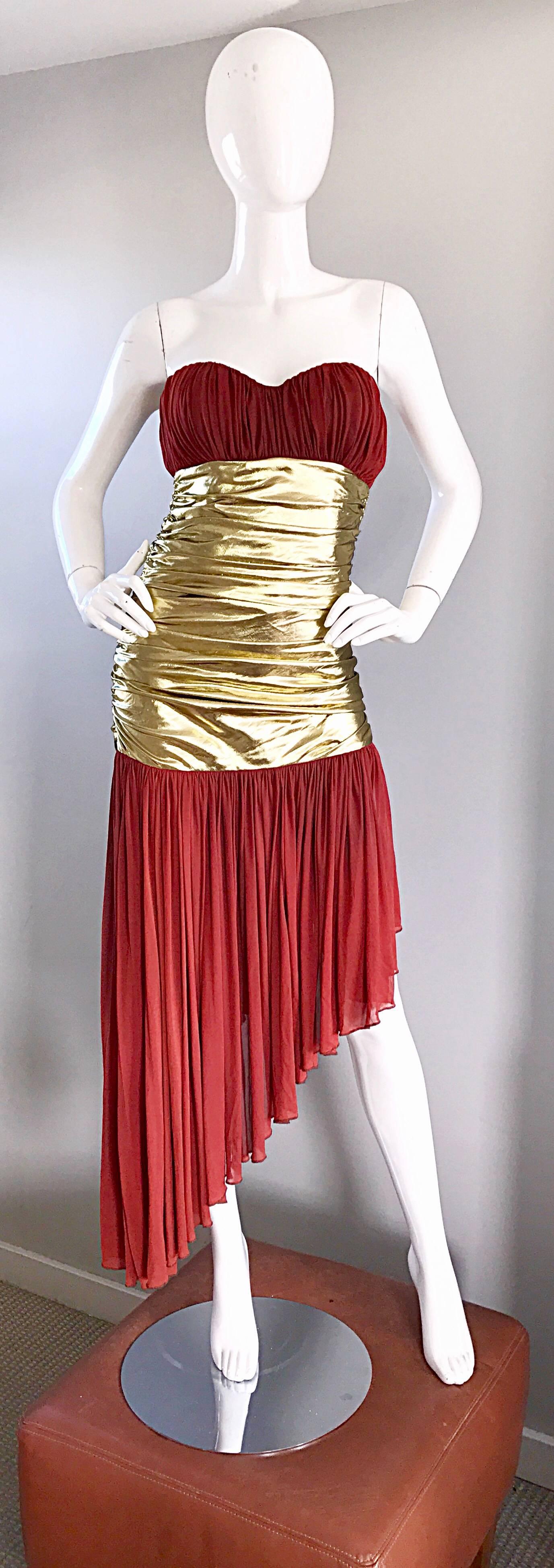 Amazing vintage ANGELO TARLAZZI Couture rust red and gold metallic strapless Avant Garde cocktail dress! Features a lovely rust hue, with gold silk metallic ruching at waist. Boned bodice keeps everything in place. Flirty asymmetrical hi-lo hem.