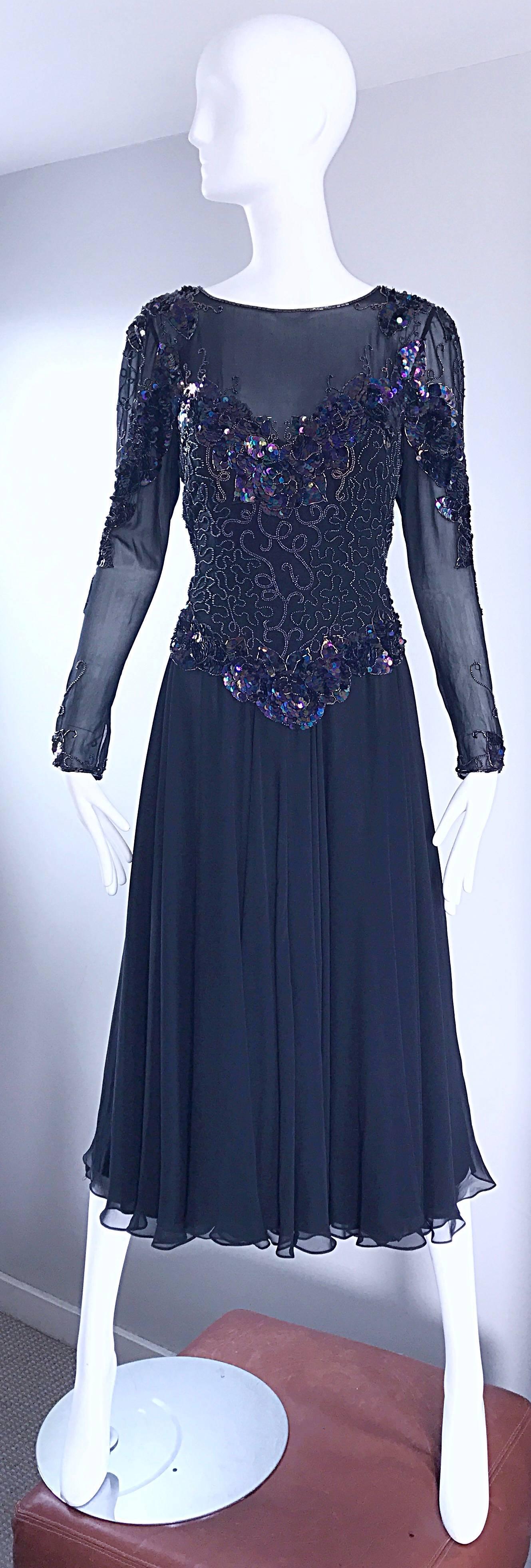 Beautiful vintage early 1980s (1982) ELETRA CASADEI black silk chiffon cocktail dress! Features a strapless bustier dress, with attached chiffon overlay. Thousands of hand-sewn sequins and beads throughout the chiffon overlay and sleeves. Wonderful