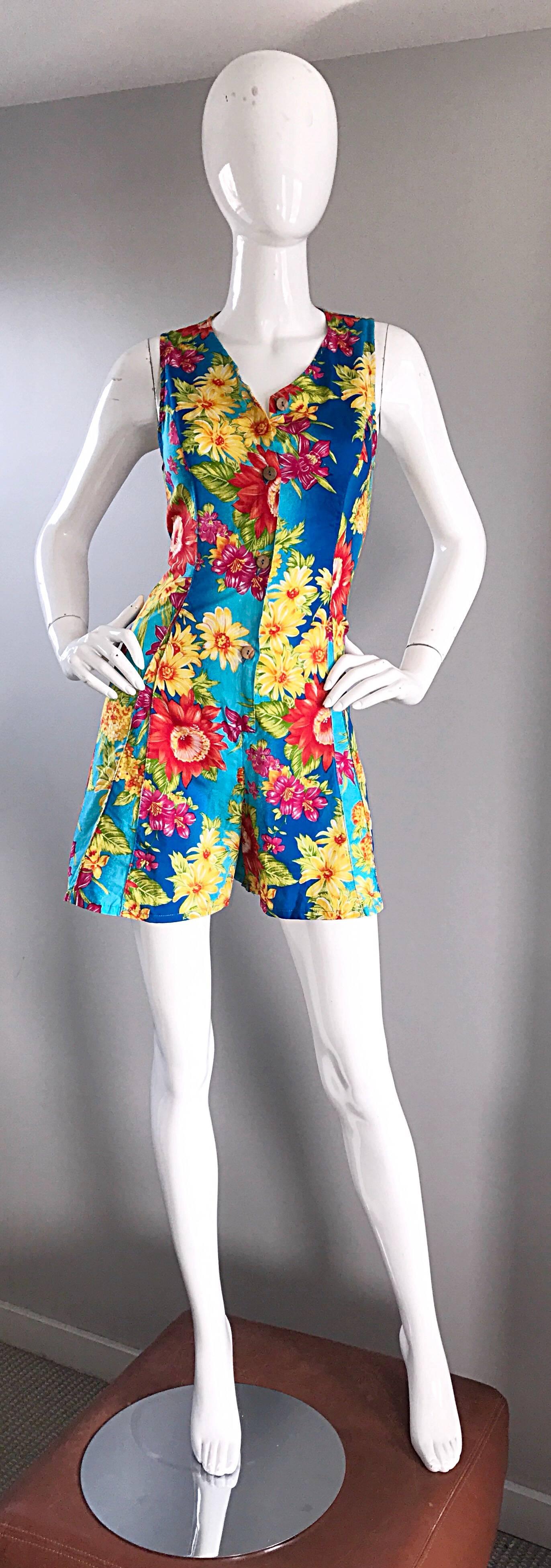 1990s Vintage Italian Hawaiian tropical print onesie romper! Features an amazing vibrant tropical print throughout. Wooden buttons up the front. Flattering fitted bodice, with slightly wide legs. So chic, and on point! No fabric label, but feels