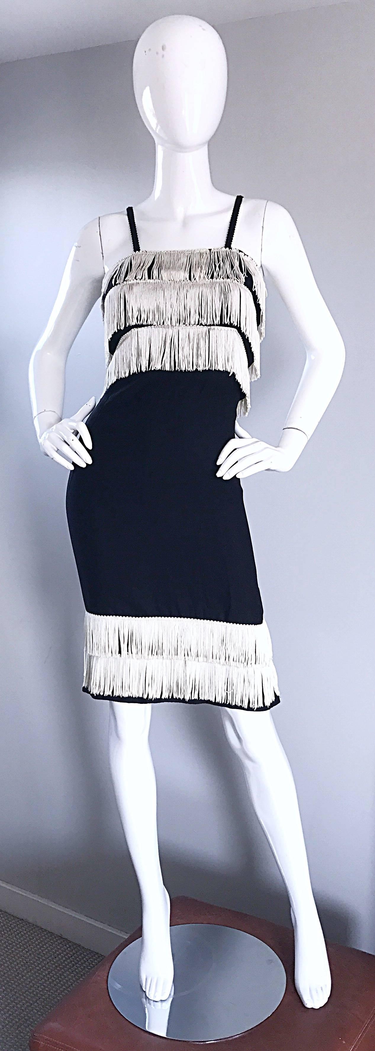 Chic 1950s black and white fringe flapper fringe dress, with a 1920s twist! Wonderful soft black crepe, with a body hugging wiggle fit. Fringe at bust and hem. Full metal zipper with hook-and-eye closure. Looks amazing on! Great for any day or