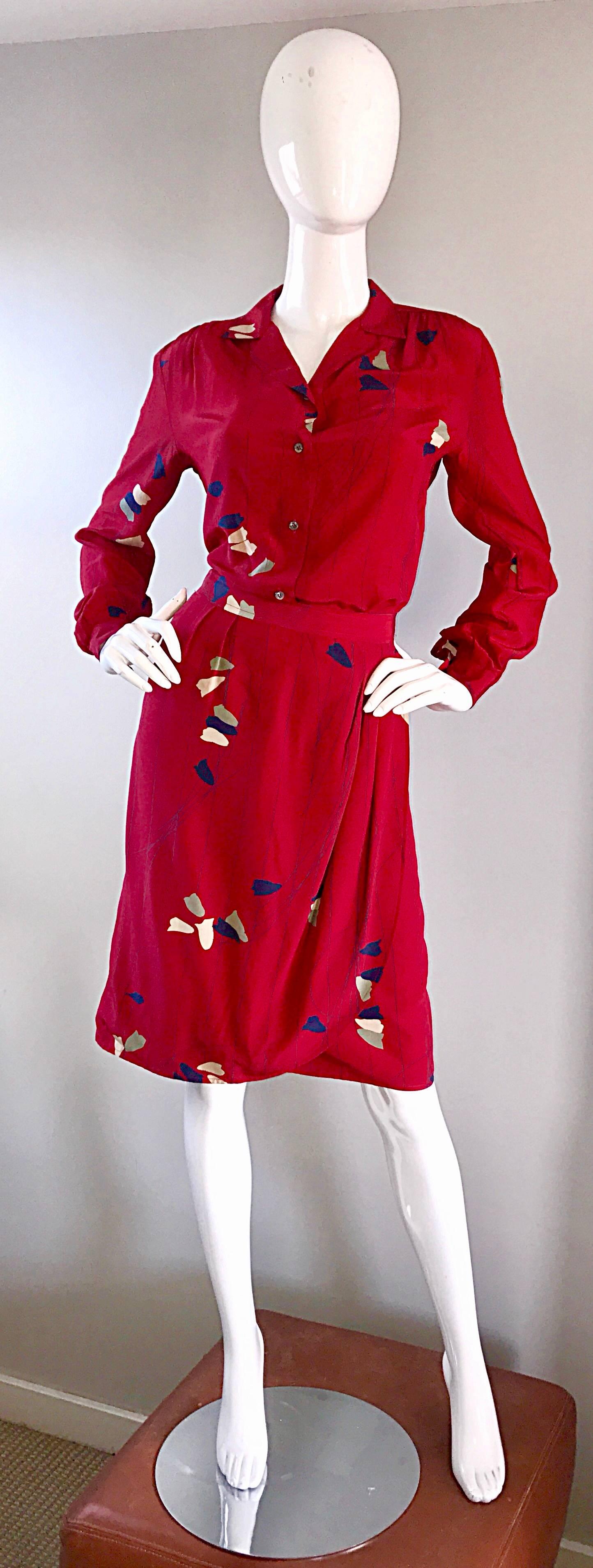 Beautiful and classic 1970s ALAN AUSTIN red silk blouse and skirt set! Luxurious bright red silk, with a chartreuse green, blue, and ivory foliage print throughout. Skirt drapes beautifully, with a wrap-like style. Blouse buttons up the bodice, with