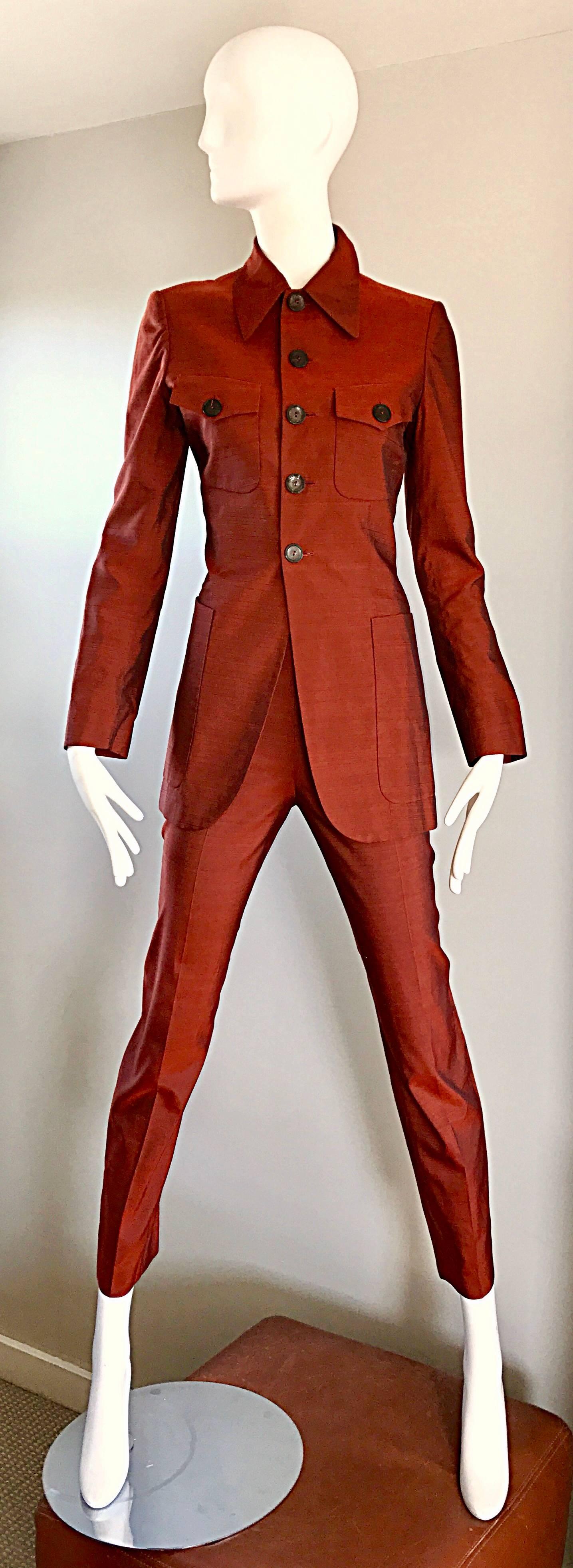 Fabulous vintage early 90s JEAN PAUL GAULTIER rust / burnt orange colored silk shantung cigarette suit! Features a stylish long blazer, with buttons up the bodice. Four functional pockets of the front of the jacket. High waisted skinny cigarette
