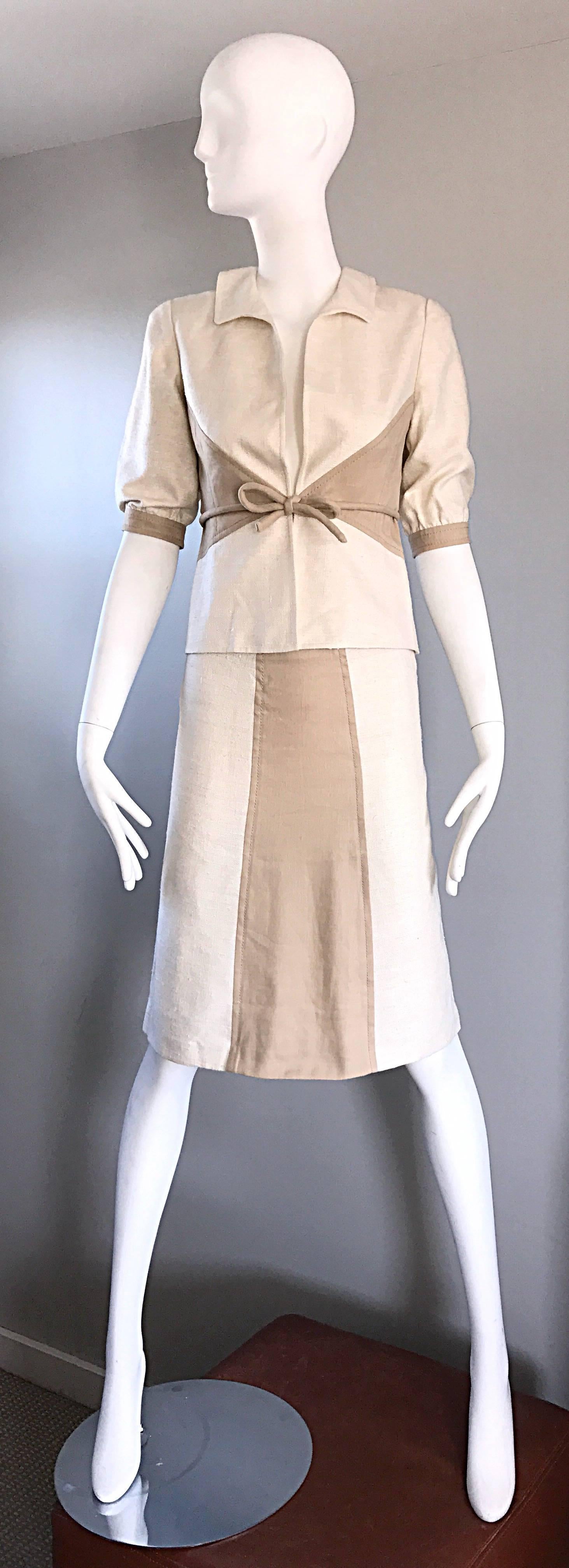 Chic brand new with tags 2004 VALENTINO color block short sleeve ivory and beige/taupe textured silk skirt suit! Retailed for $3,590 at Neiman Marcus! Features color blocking detailon both the short sleeve jacket, and skirt. Luxurious textured silk