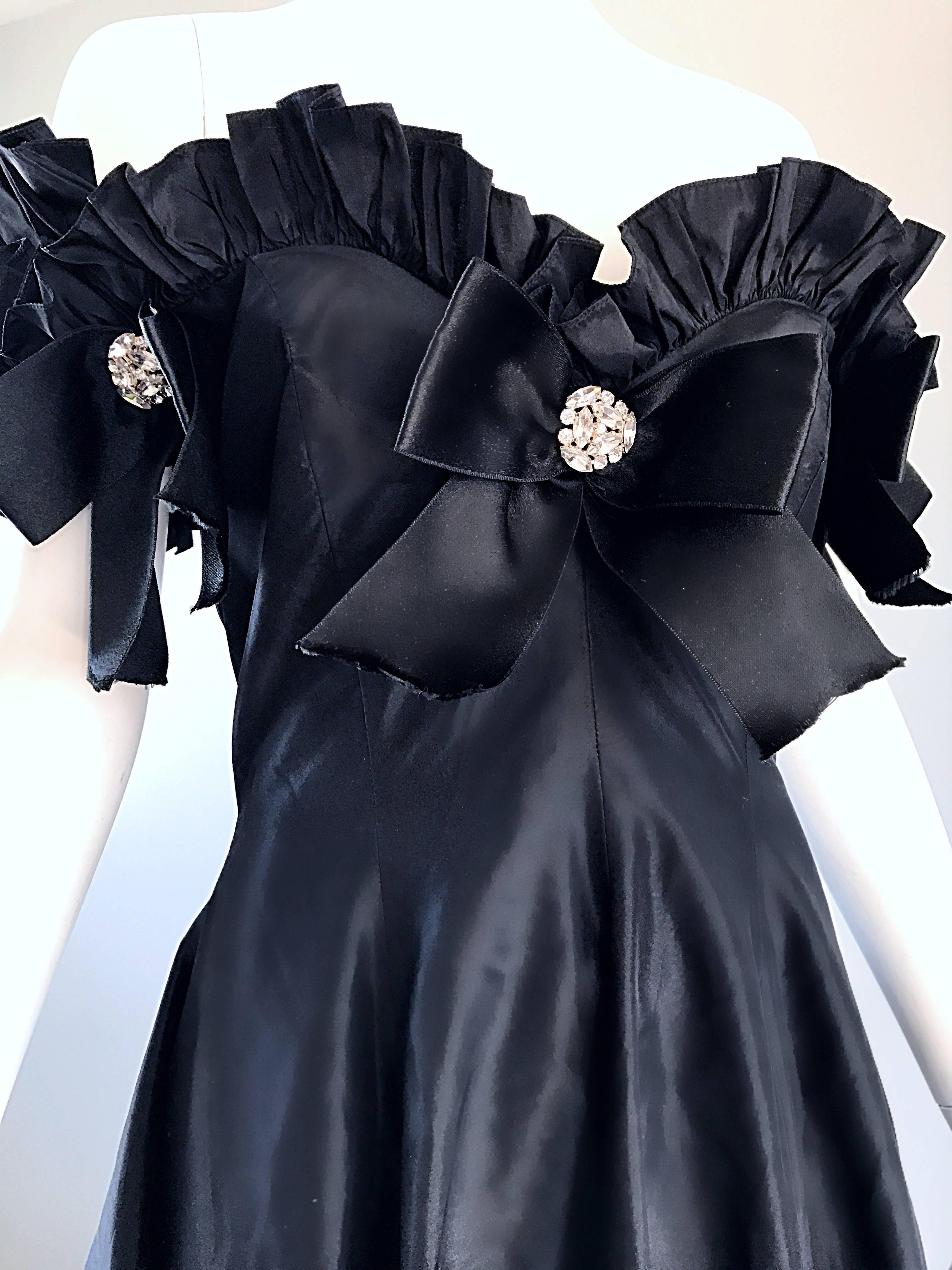 Spectacular vintage OSCAR DE LA RENTA black silk taffeta evening gown! Couture quality from this legendary American designer! Off-the-shoulder style is so stylish! Three bows adorn the bodice, with Swarovski rhinestones at each center. Intricate