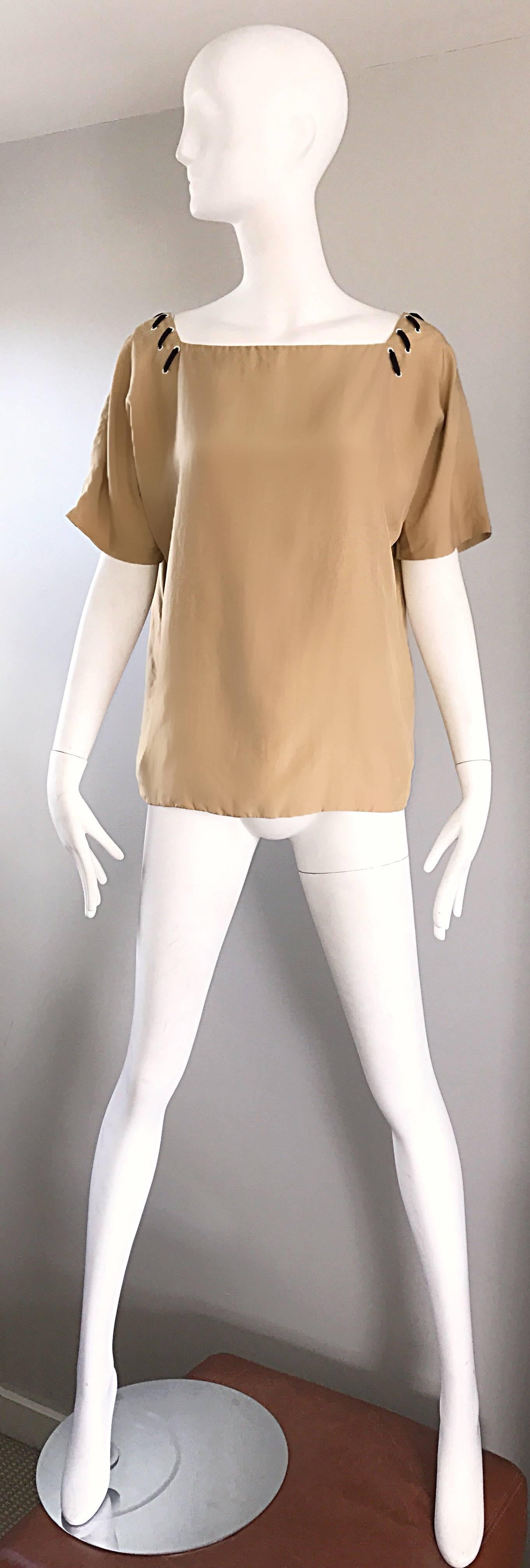 Chic 1990s FENDI, by KARL LAGERFELD tan silk tunic top! Luxurious soft fine silk feels great against the skin. Great with shorts, jeans or trousers. In great condition. Made in Italy.
Marked Size EU 42
Measurements:
Up to 44 inch bust
Up to 38 inch