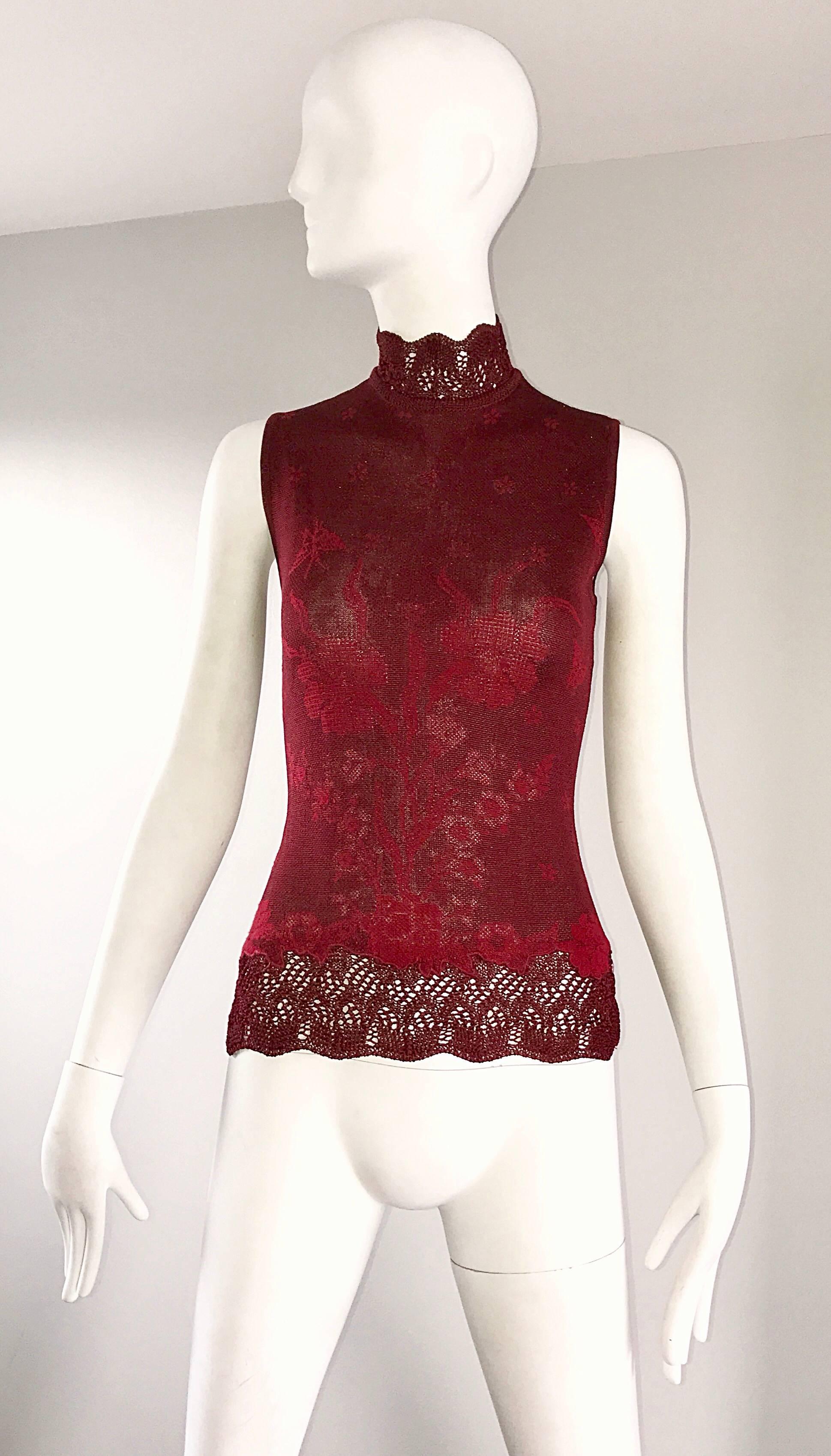 Beautiful vintage 90s KENZO red wine colored Asian inspired sleeveless blouse! Features butterflies and flowers throughout. Hand crochet work at the high collar and hem. Rayon knit blend stretches to fit the body. Buttons up the back collar. Can