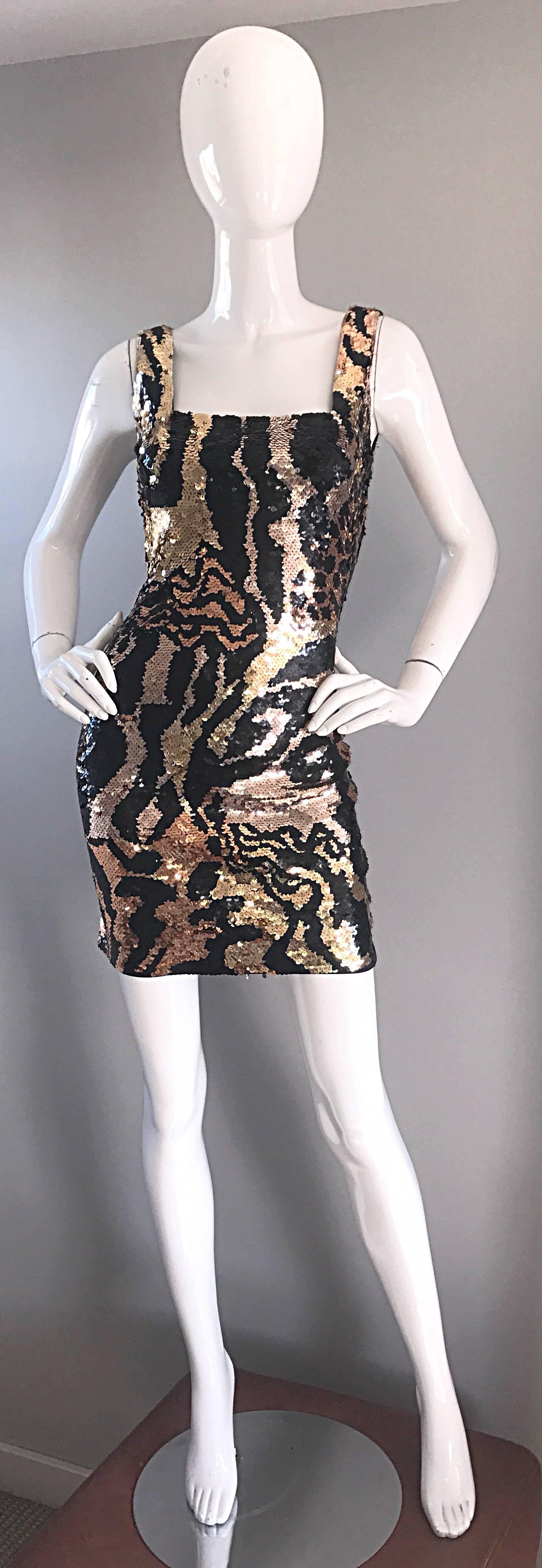 Sexy vintage 1990s OLEG CASSINI black, gold, and rose gold bronze bodcon mini dress! Features thousands of hand-sewn sequins with abstract animal prints in zebra, leopard, and tiger throughout. Flattering bodycon fit stretches to fit, and looks