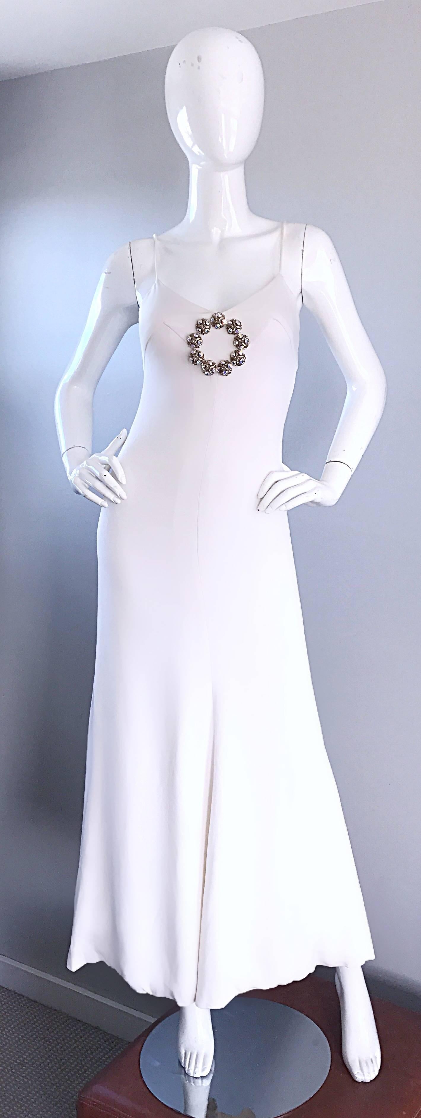 Sensational vintage 70s OSCAR DE LA RENTA Couture white rayon crepe gown! Double ply soft crepe hugs the body in all the right places. Heavy Swarovski rhinestone encrusted appliqué at center bust. Couture quality, with heavy attention to detail.