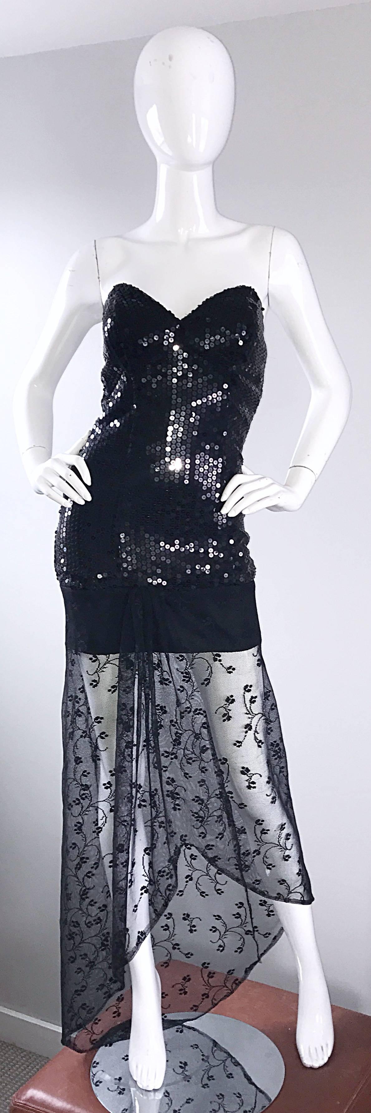 Sexy 90s black sequin hi-lo strapless bodycon dress! Features hundreds of hand-sewn black sequins throughout. Asymmetrical black French lace hem dips to a longer train in the back. Hidden zipper up the back with hook-and-eye closure. Interior boning