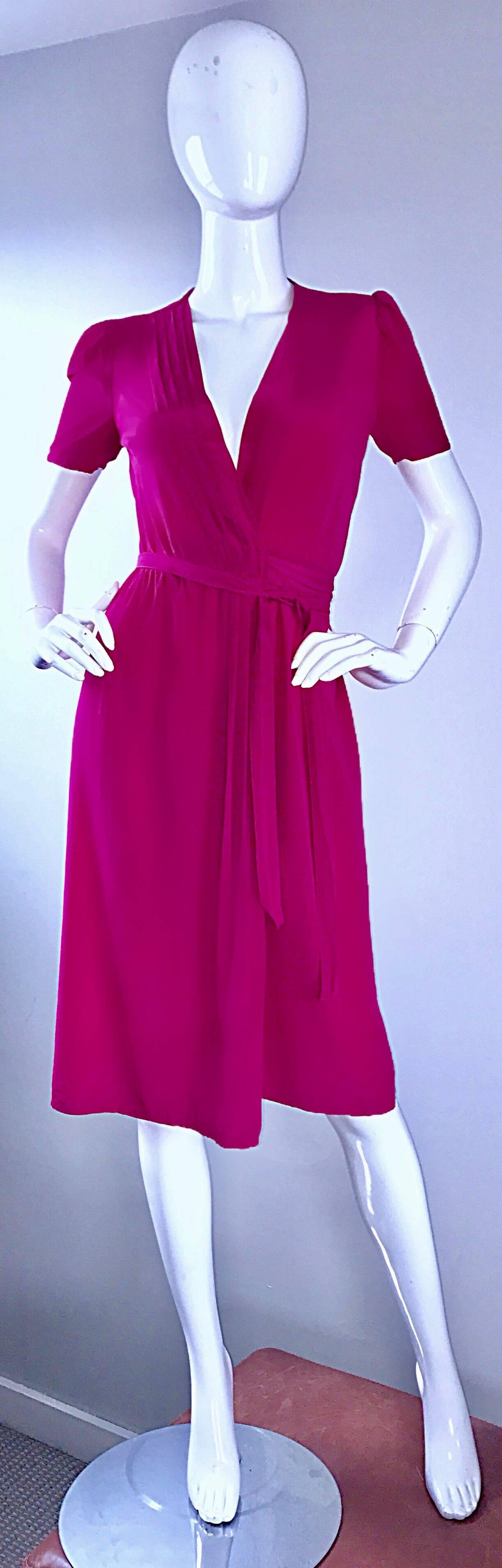 Chic and classic 70s DIANE VON FURSTENBERG shocking vibrant pink silk signature wrap dress! Features the most luxurious soft silk that clings to the body in all the right ways! This is the wrap dress that put DVF on the map. Ties at either side of