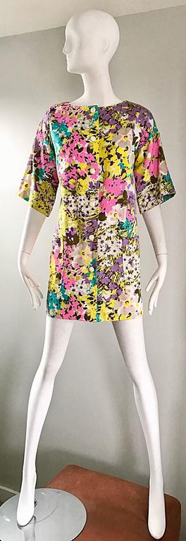 Chic mid 60s TORI RICHARD for I MAGNIN mini A - Line dress or swing jacket! Features vibrant pastel colors in pink, purple, teal blue, yellow and white. Pocket at each side of the waist. Snaps up the bodice. 3/4 sleeves. Great alone with sandals or