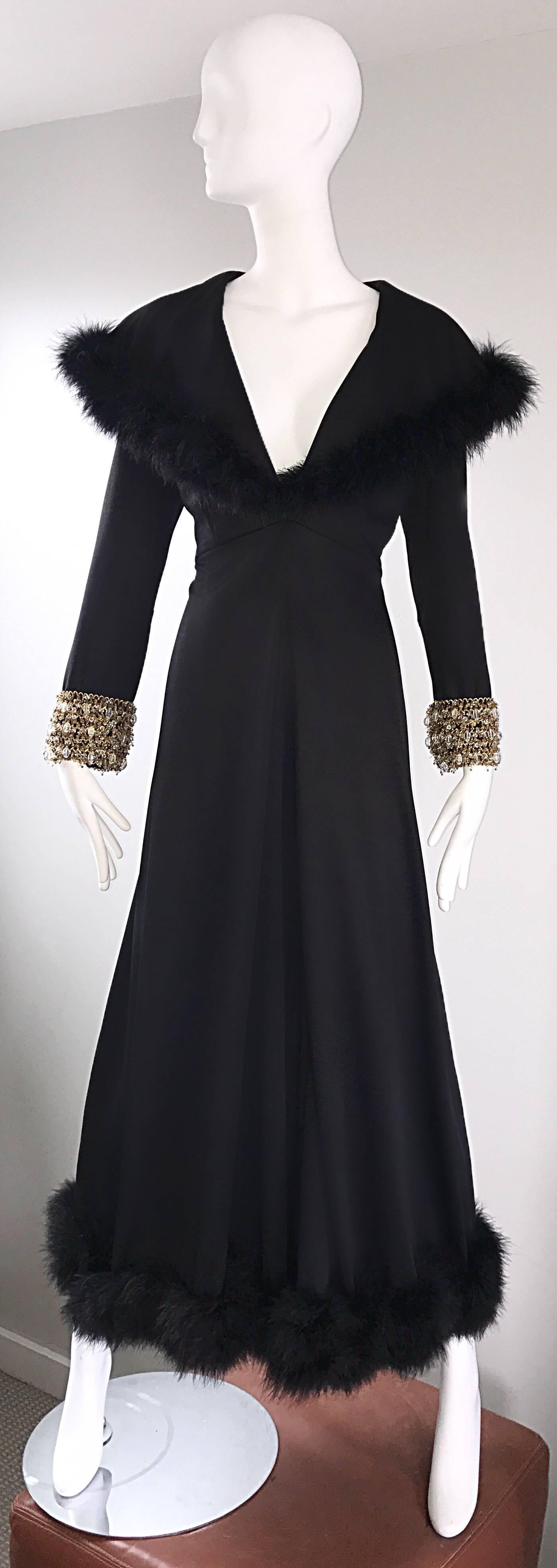 Absolutely sensational 1970s black jersey couture palazzo leg jumpsuit! I don't even know where to begin with this one! Couture quality, with so much attention to detail. Black feathers align the collar near the shoulders, and the hem to both legs.