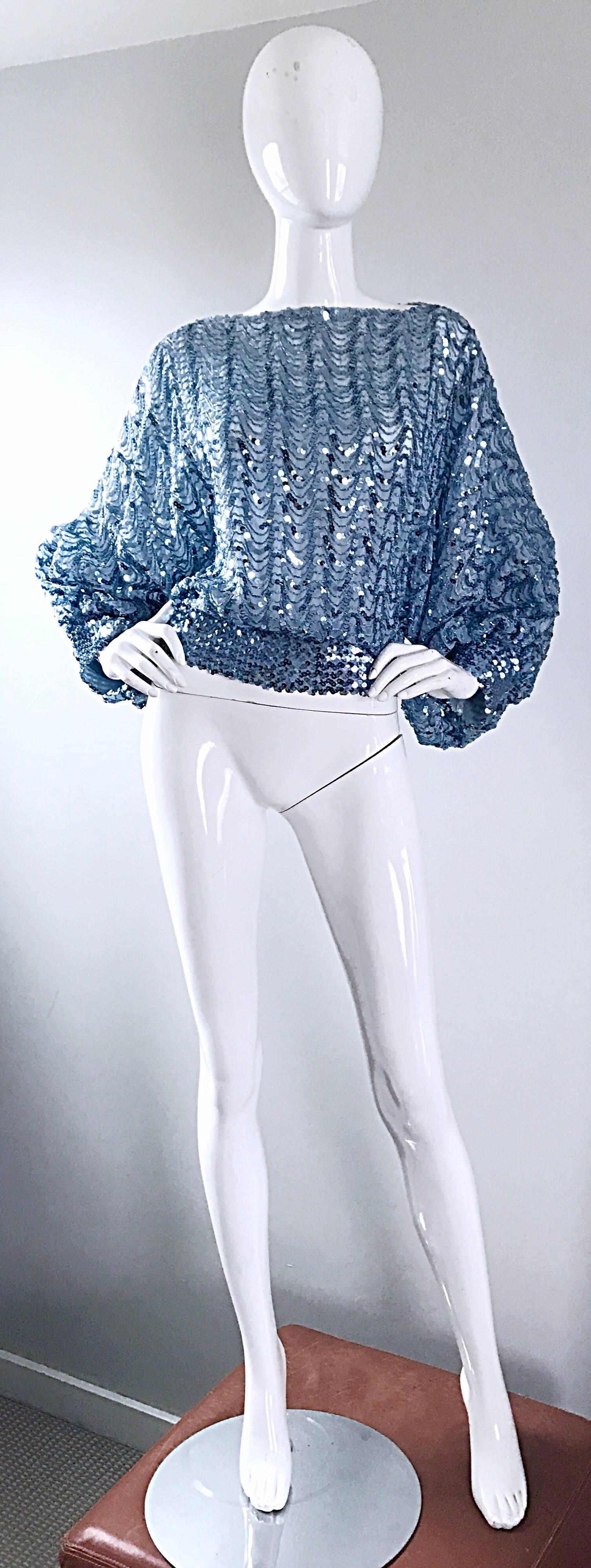 Incredible vintage JEANETTE KASTENBERG for ST. MARTIN pale blue silk sequin diso blouse! Slouchy fit, with elastic waistband and sleeve cuffs. Chic dolman sleeves make this beauty easy to wear for nearly all shapes and sizes! Single button at top