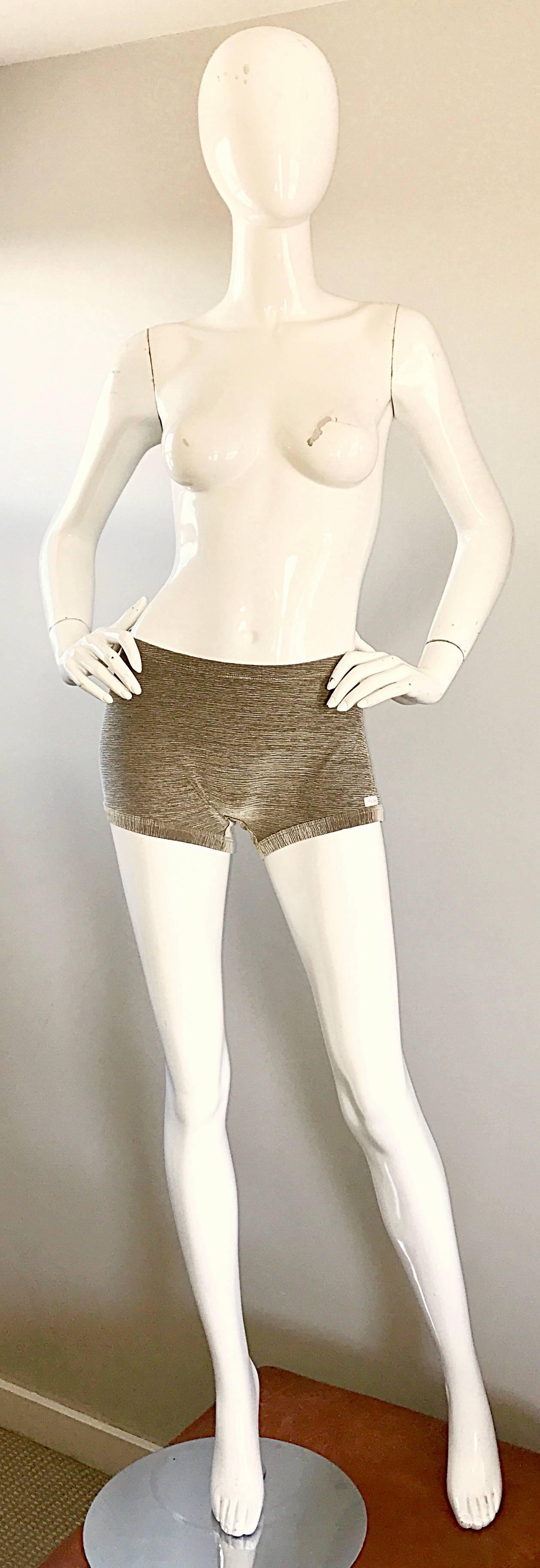 Sexy vintage 70s PIERRE CARDIN gold metallic disco hot pants! These shorts are simply amazing on! Italian made, with lots of stretch. Gold with thin black lines throughout. Pierre Cardin tag discreetly attached at left side leg. In great unworn