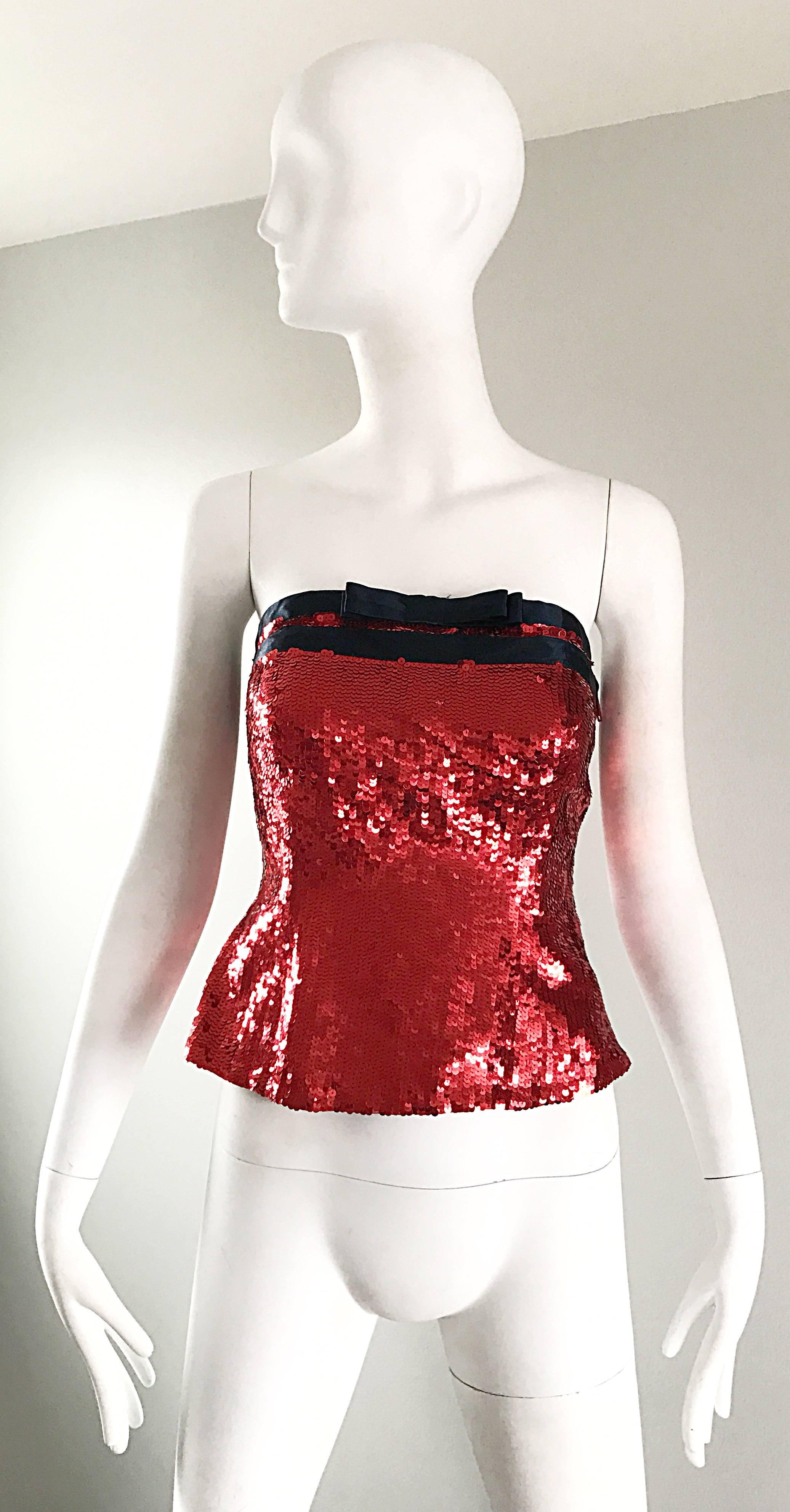 1990s  (brand new with original Neiman Marcus price tag still attached) 90s Vintage BILL BLASS red sequin strapless bustier top! Features thousands of hand-sewn sequins throughout. Two black silk satin strips of ribbon with a bow accent above center