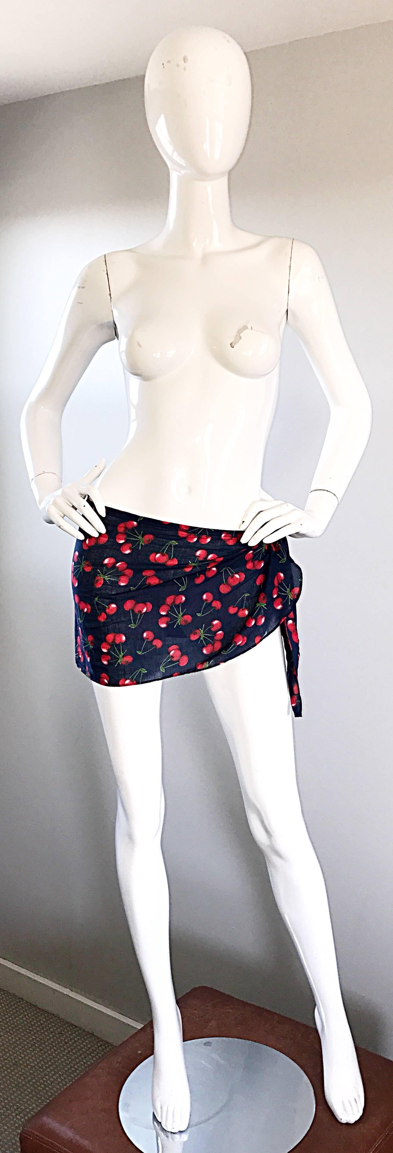 Sexy new with tags vintage 1990s DOLCE AND GABBANA black and red cherry print wrap skirt! The perfect cover up for the beach, pool or yacht. Lightweight cotton. TIes at the side of the waist, so can fit most sizes. In great unworn condition. Made in