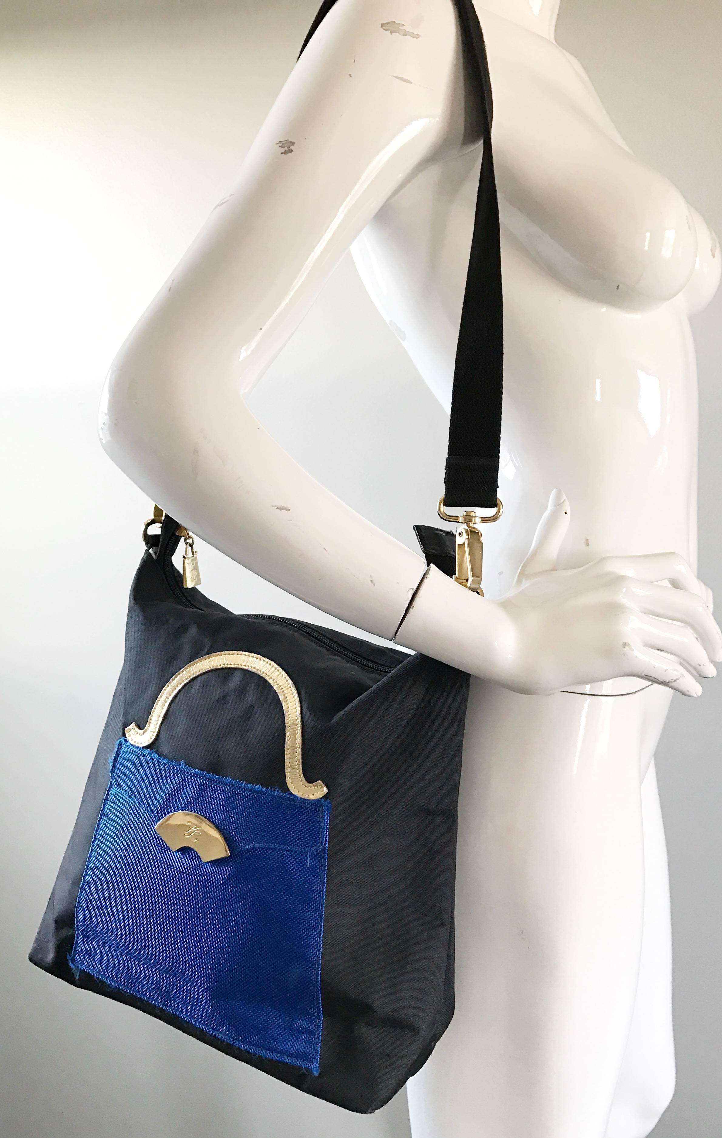 Amazing 90s KARL LAGERFELD nylon trompe l'oeil handbag! Features a purse on a purse! Vibrant royal blue and black with white gold leather. 'KL' plaque at center. Blue section features a behind pocket. Zipper top secures everything, and features an
