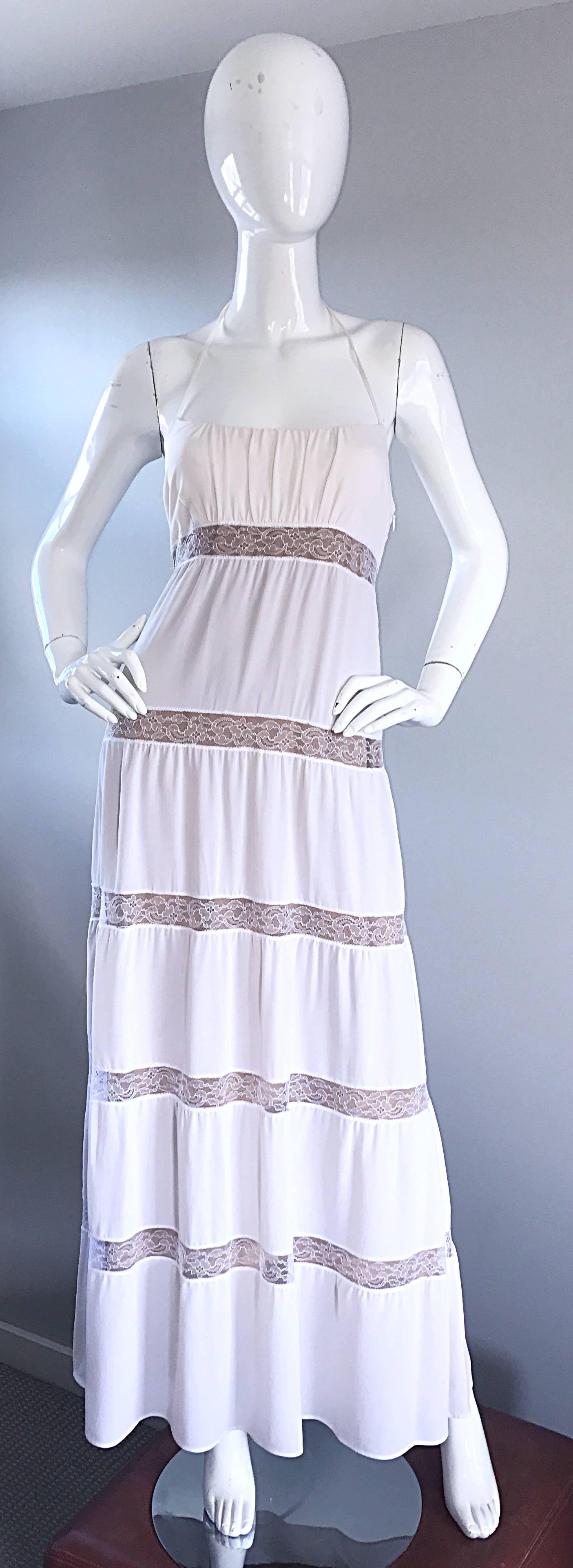 Gorgeous MICHAEL KORS COLLECTION white and nude / tan silk maxi dress! Features strips of lace throughout the dress that reveal the nude lining. Halter neck ties at the back neck. Flattering ruching on the bodice. Hidden zipper up the side with