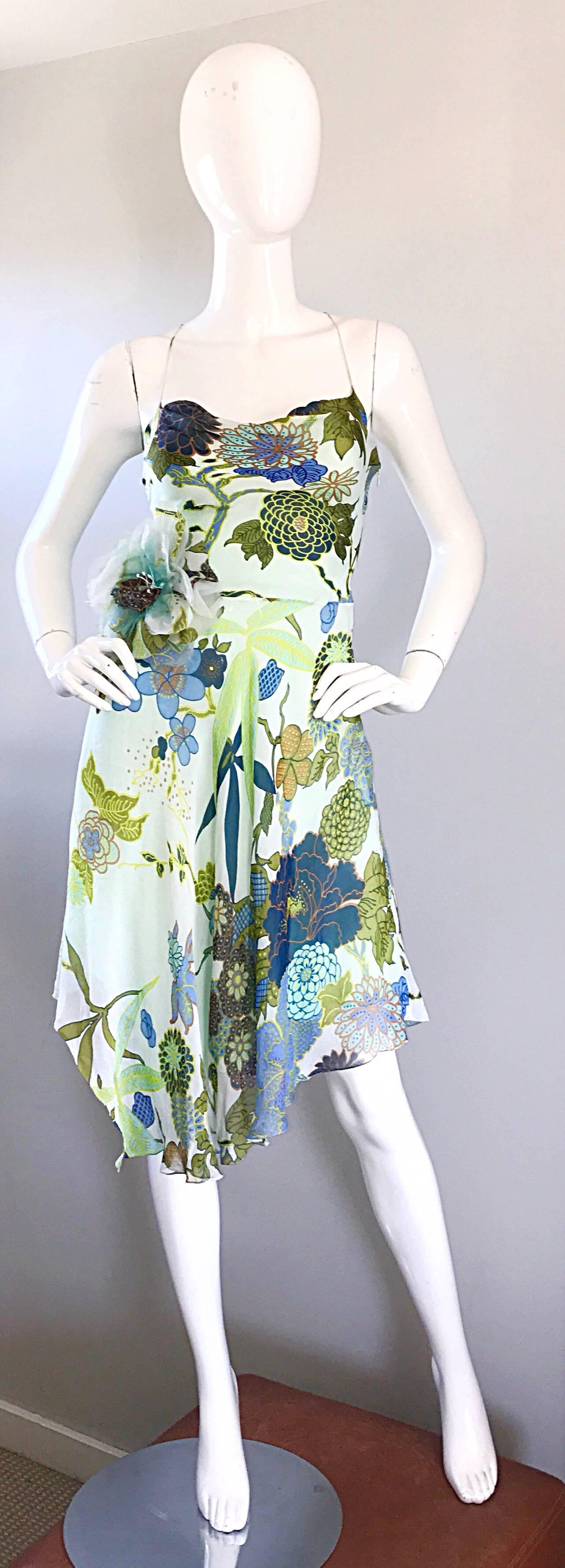 Pretty and flirty 90s JENNY PACKHAM silk chiffon vintage handkerchief hem dress! Features warm vibrant colors of blue, green, chartreuse, teal, and Burt orange throughout. Features a corsage flower at right side waist. Halter neck, with a