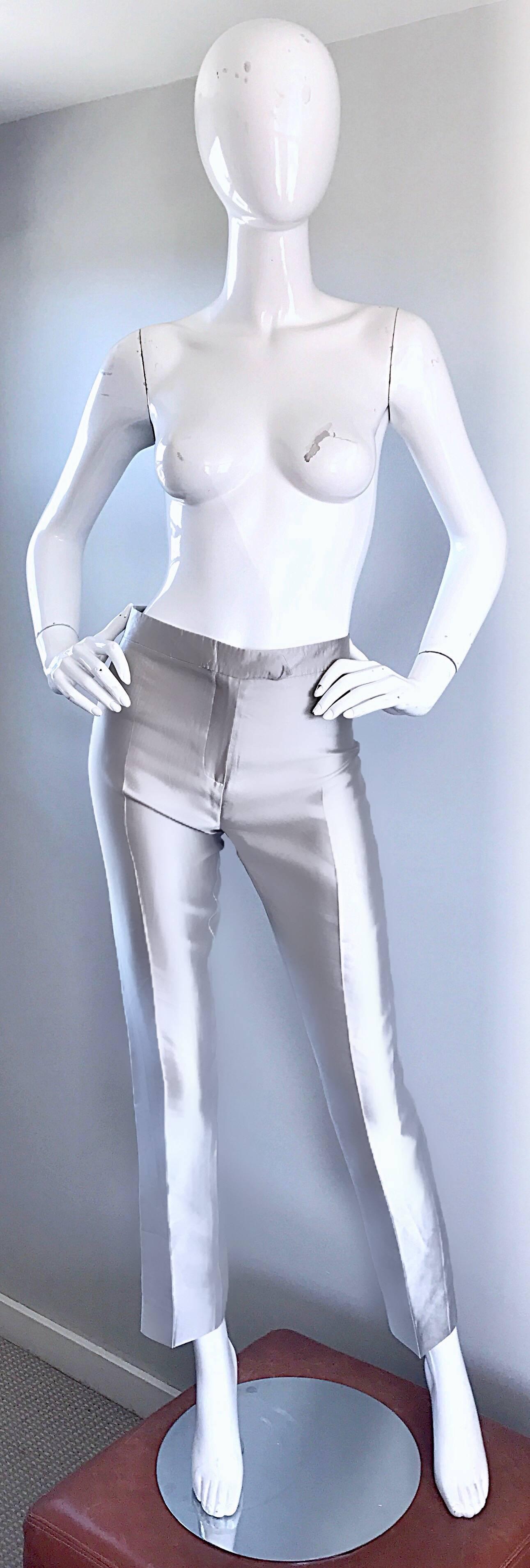 Amazing vintage early 90s (never worn) OSCAR DE LA RENTA high waisted silver metallic silk cigarette trousers! Super flattering high waisted fit, with slim, slightly cropped tailored legs. Two mock pockets on the rear. Such a wonderful fit that
