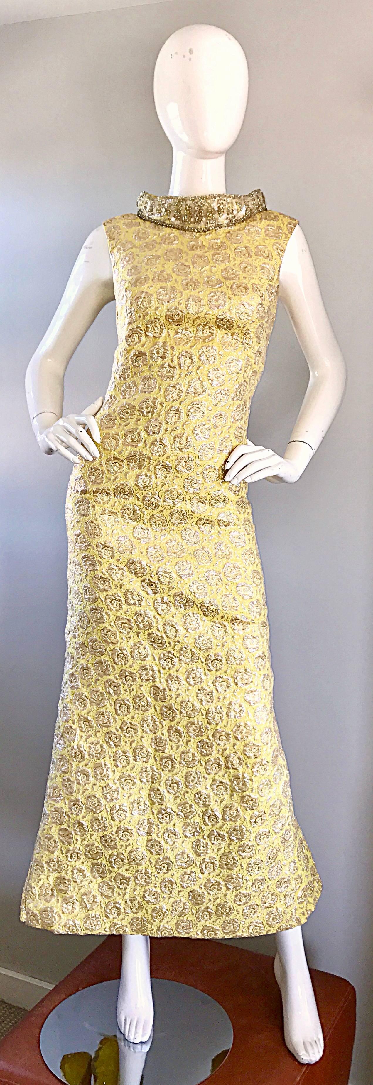 Showstopping 50s demi couture mermaid evening dress! Vibrant yellow and gold silk brocade. Features a dramatic sequined and beaded high collar. Fitted bodice, with a flared skirt. Back skirt also features a strip of sequins and beads above the