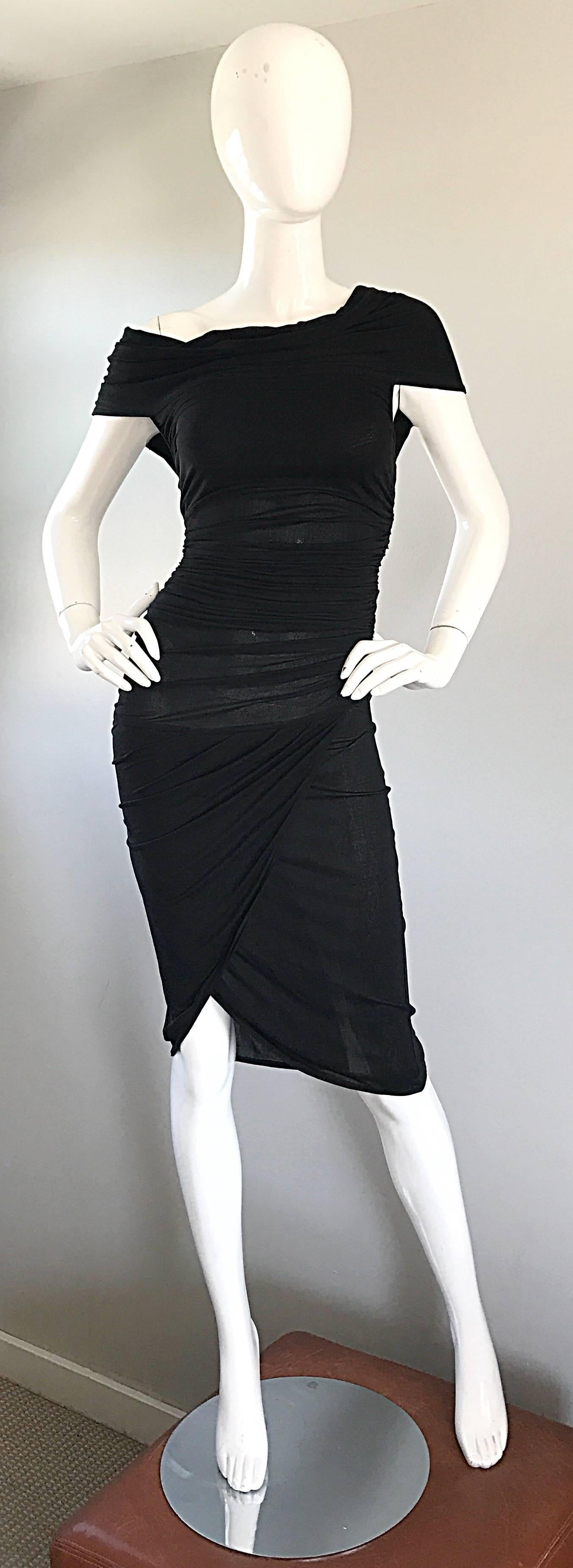 Sexy CELINE 90s black vintage bodcon dress! This is the perfect little black dress! Features flattering ruching detail thorughout. Semi sheer in all the right places, that do not require additional undergarments. Sits off one of the shoulders.