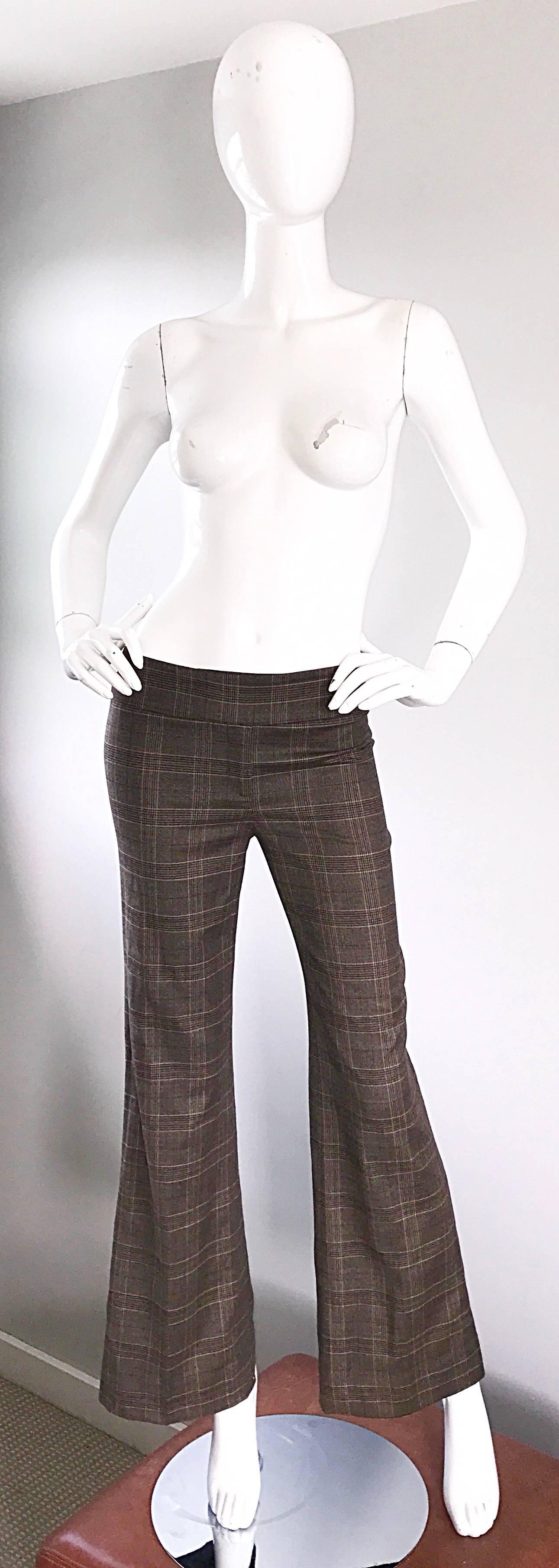 Chic and brand new MICHAEL KORS COLLECTION brown glen plaid virgin wool flared leg low rise trousers! Features a timeless glen plaid thorughout in browns and dark purple. Flattering low rise, with zip fly, interior button closure, and two buttons at