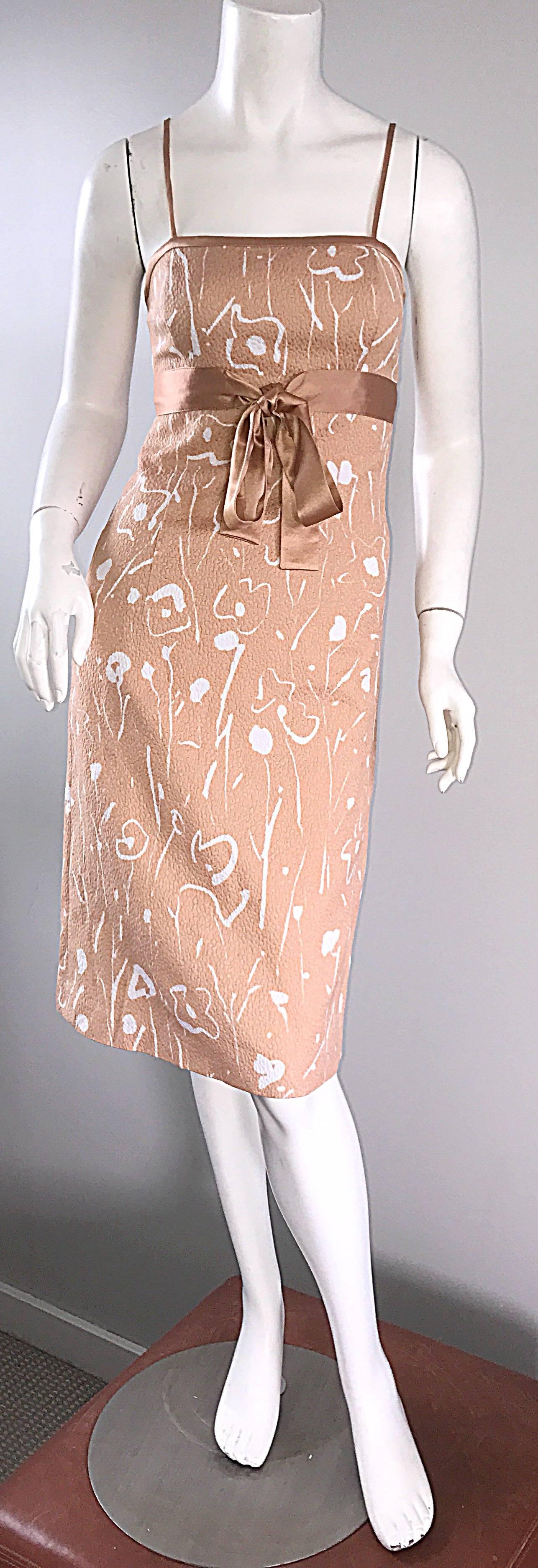 Beautiful new 90s vintage LUCA LUCA peach / pink and white dress! Features white abstract flower prints throughout. Textured soft silk blend fabric (42% Cotton, 23% Rayon, 35% Silk). Fully lined in 100% Silk. Attached silk ribbon belt ties in the