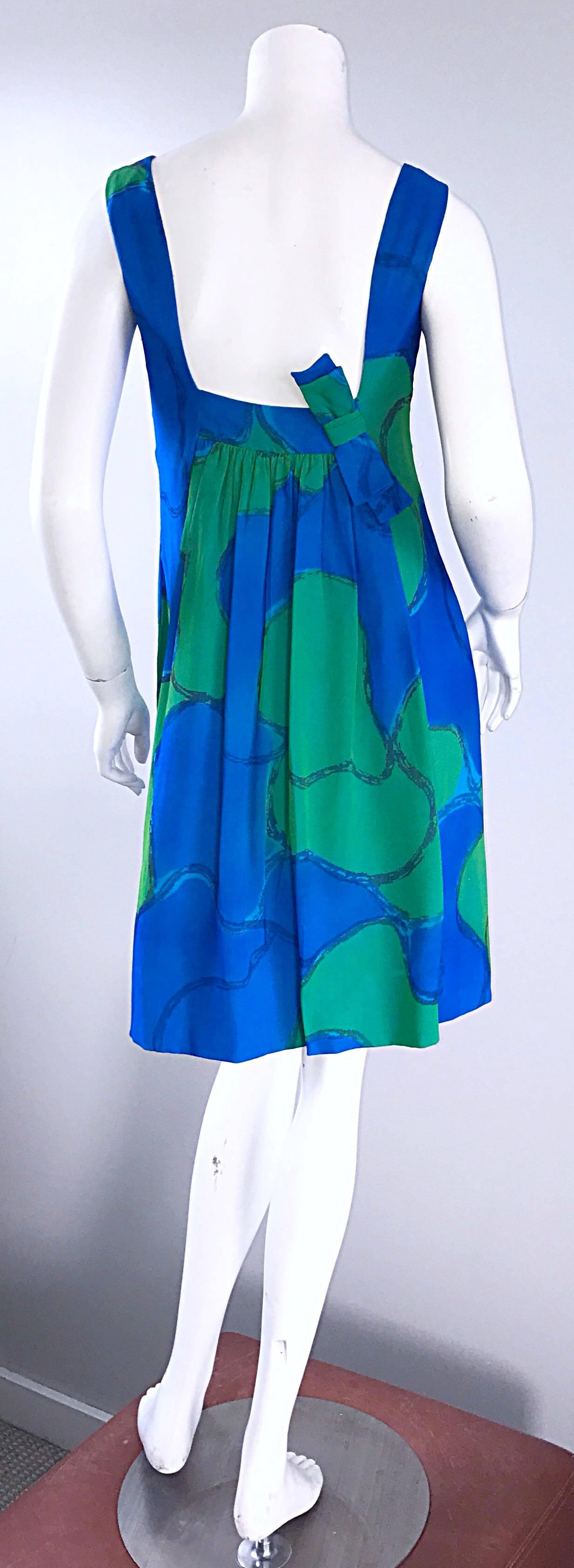 Insanely chic vintage early 60s silk chiffon turquoise blue and kelly green watercolor print demi couture shift dress! Classic shift silhouette is flattering, yet comfortable. Amazing details on the back. Features a full metal zipper, with