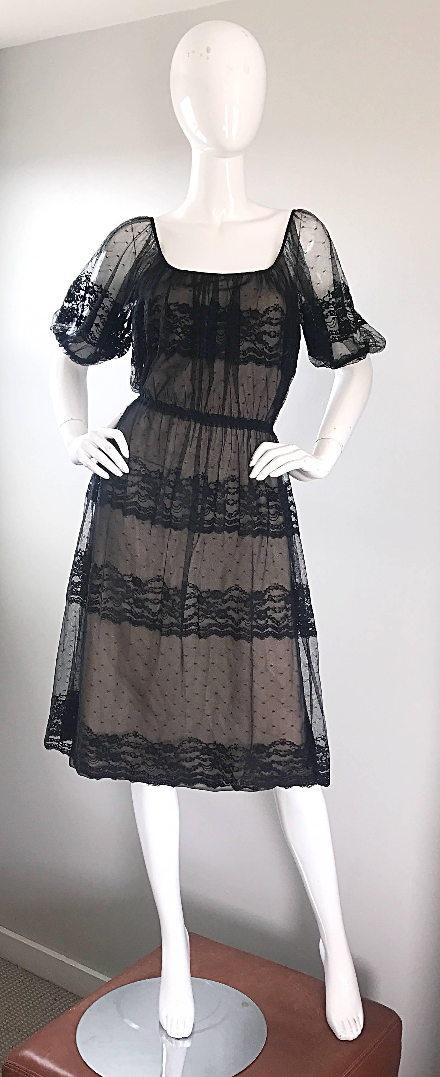 Beautiful vintage late 70s JEANNENE BOOHER black and nude silk lace dress! Features black French chantilly lace over a nude silk lace underlay. Slight puff sleeves with elastic cuffs. Elastic waistband make this beauty accessible to an array of