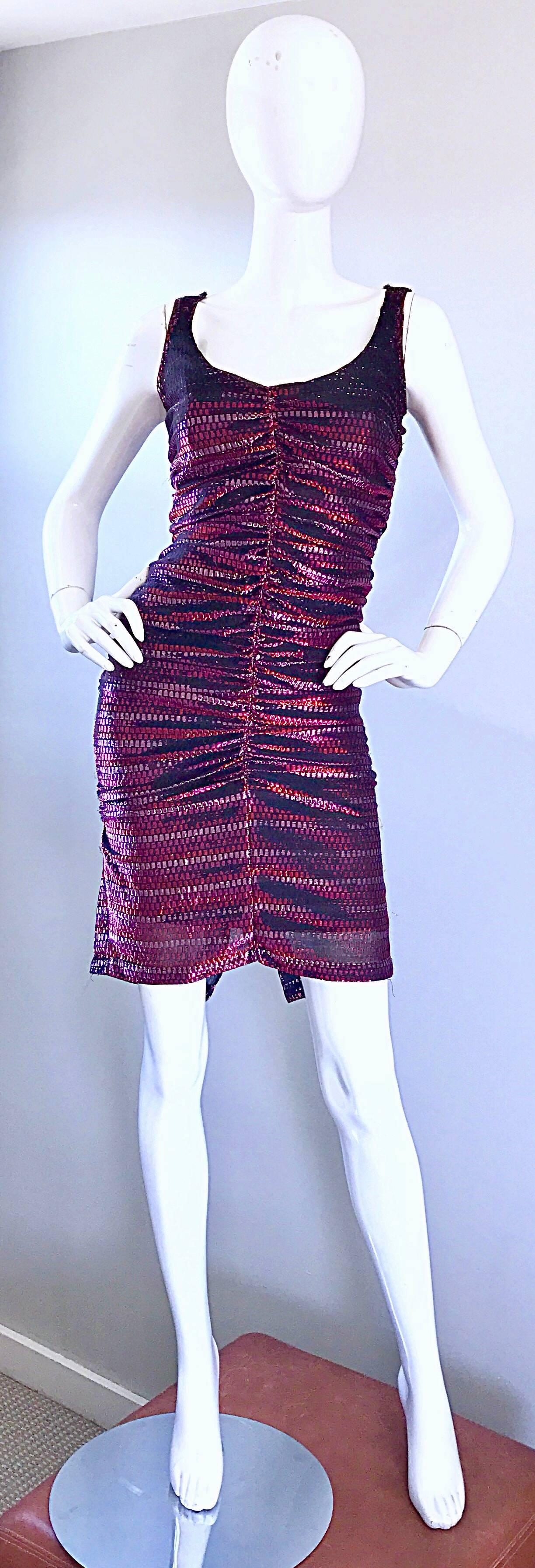 Sexy late 1970s pink and red metallic ruched disco dress! Flattering ruching throughout looks amazing on the body! Fully lined. Hidden zipper up the back with hook-and-eye closure. Looks great belted or alone. Perfect with heels or boots. In great