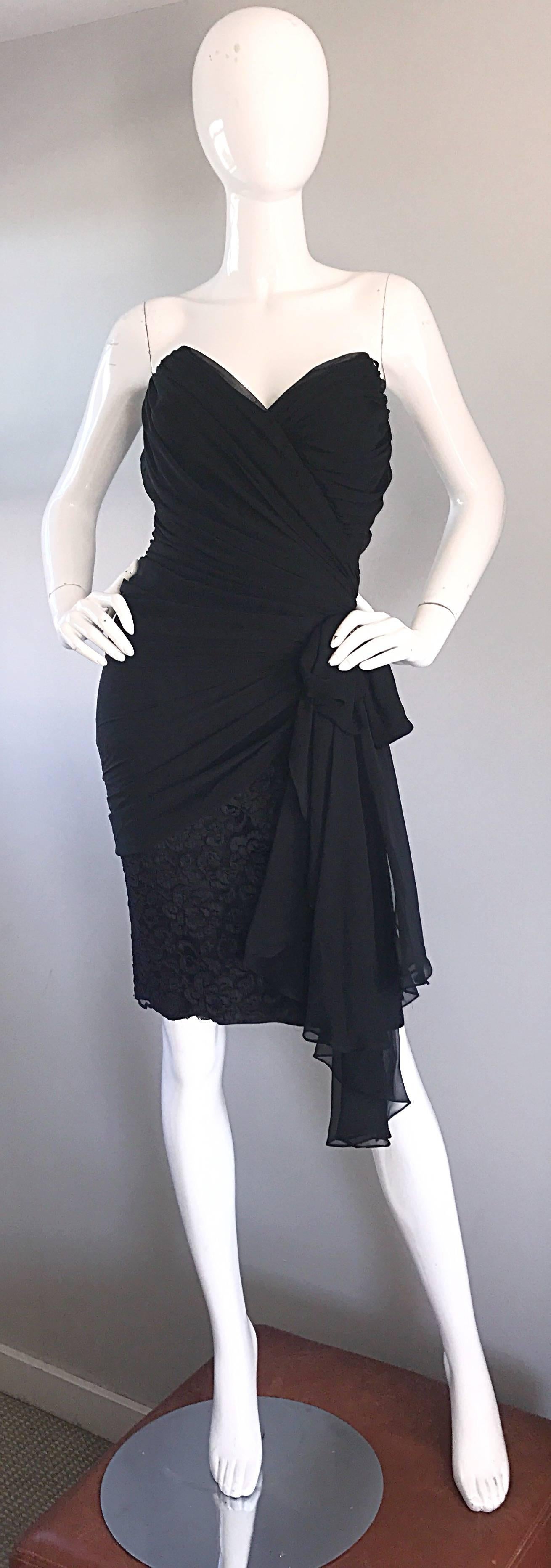 Beautiful vintage TADASHI SHOJI 1980s black strapless dress! Features a flattering draped chiffon bodice with an asymmetrical hem. Fitted lace skirt with a bow sash encrusted with rhinestones at side waist. Hidden zipper up the side with