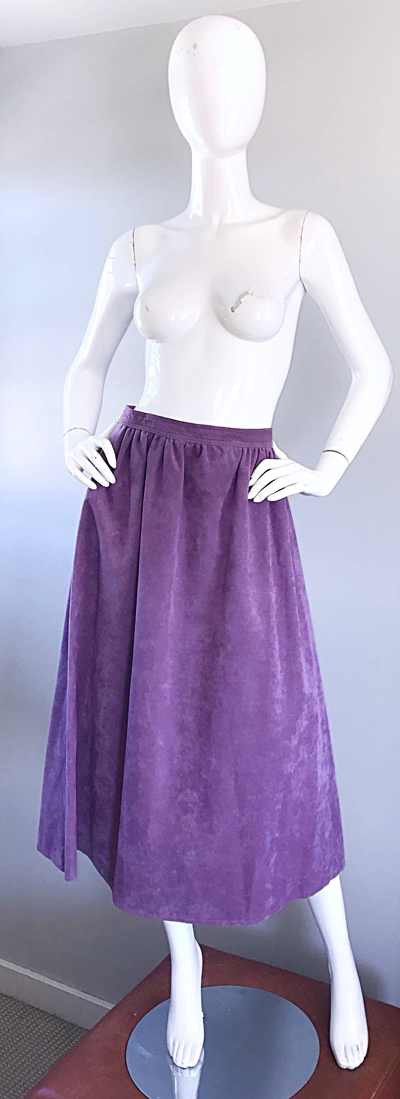 Beautiful vintage 1970s BILL BLASS ultra suede light purple / lilac A-Line midi skirt! Soft and durable ultra suede is great all year. Intricate pleating details at the waist. Hidden side metal zipper with two hook-and-eye closures to adjust size.