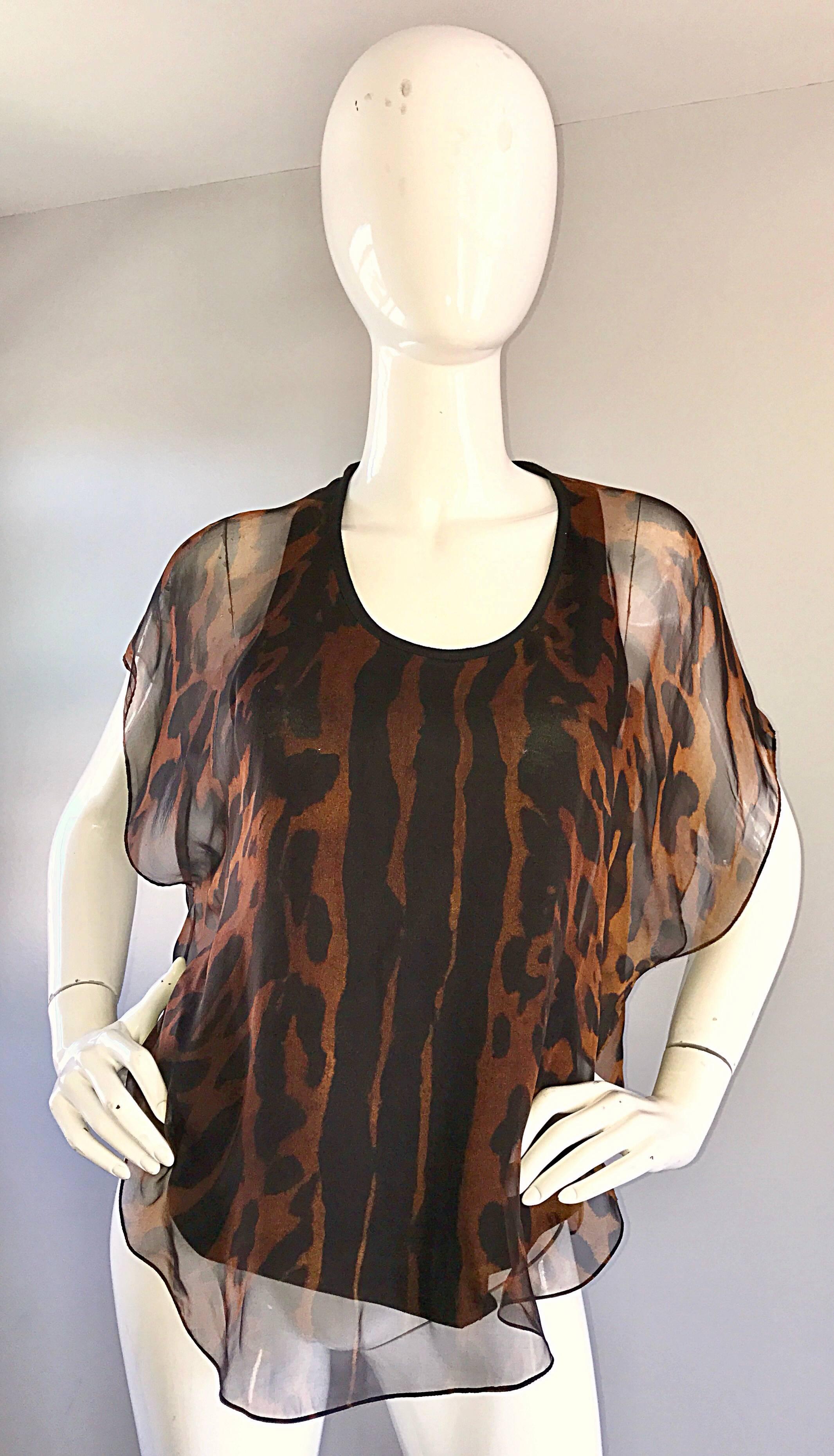 Amazing and rare early 2000s ALEXANDER MCQUEEN Pre-Death silk chiffon leopard / cheetah print top! Features a luxurious silk chiffon over a black cotton racerback top. Flutter sleeves look amazing on! Simply slips over the head. Chic, comfortable