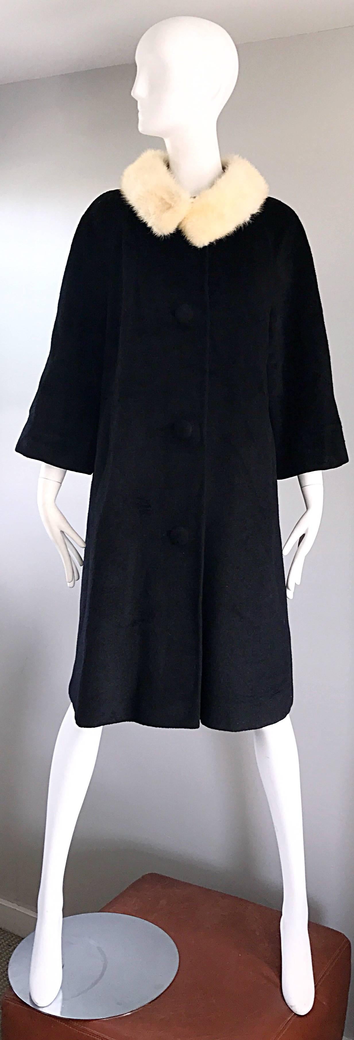 Chic 1960s 60s LILLI ANN Jackie O style black and ivory / white wool and mink fut swing coat! Luxurious soft black wool, with the signature Lilli Ann swing fit. Attached mink fur collar. Four buttons up the front of the jacket. Pockets at each side