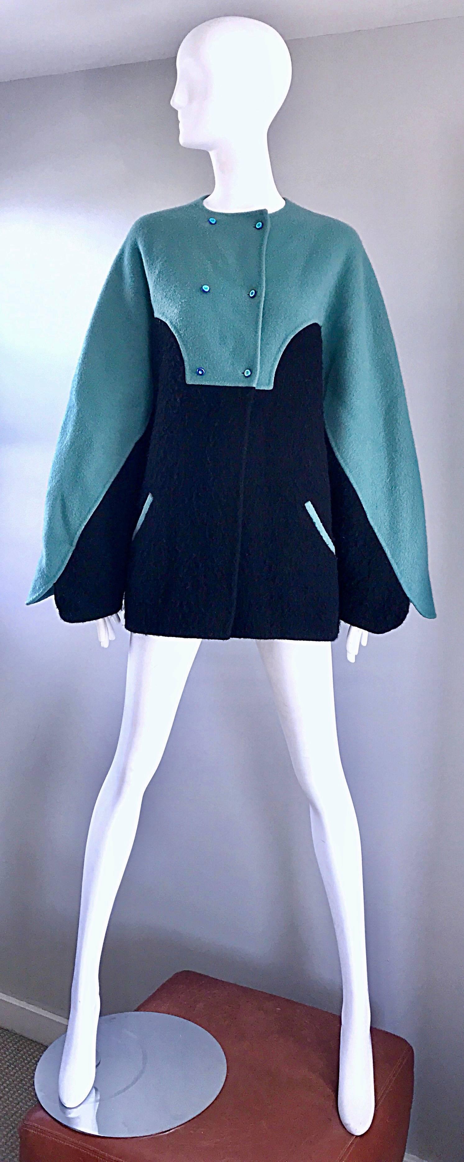 Amazing and important 1980s GEOFFREY BEENE teal aqua blue and black color block boiled wool swing jacket (almost looks like a cape ) ! Incredible amount of detail on this beauty, including hand-sewn workmanship. Small iridescent blue buttons at the