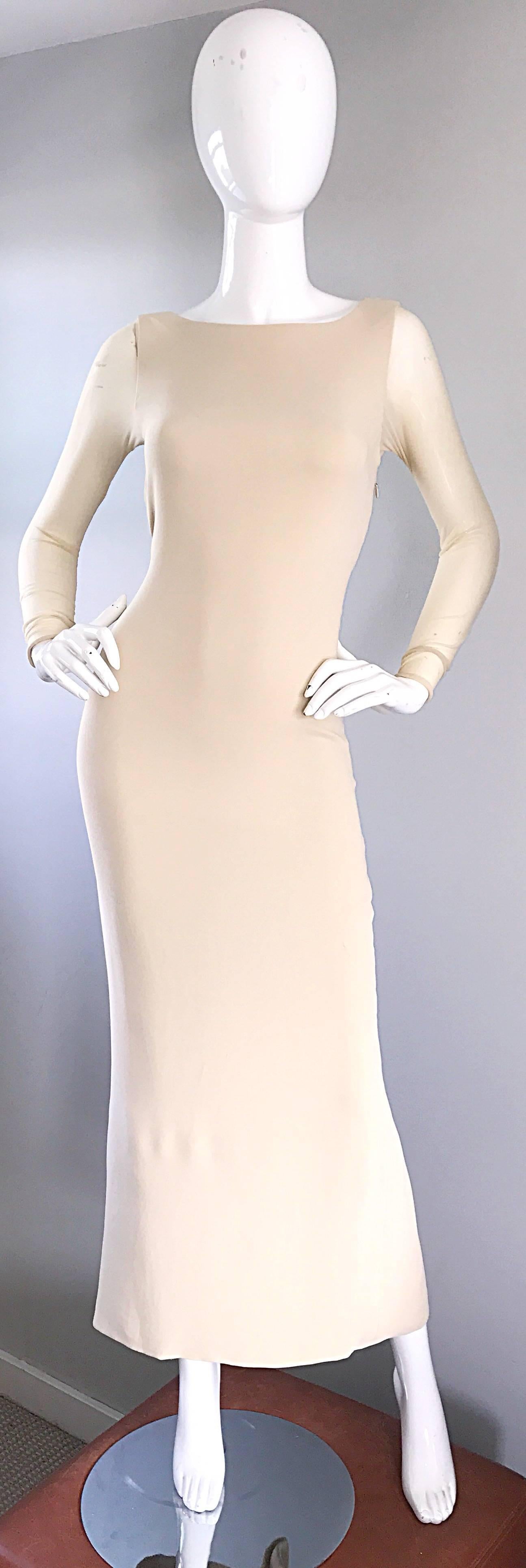Stunning early 1990s VERA WANG nude / beige silk evening dress! Wonderful form fitting silhouette stretches to fit the body. Double. Layered silk with semi sheer mesh sleeves. Semi sheer low cut cut-out detail on the back with mesh details. Hidden
