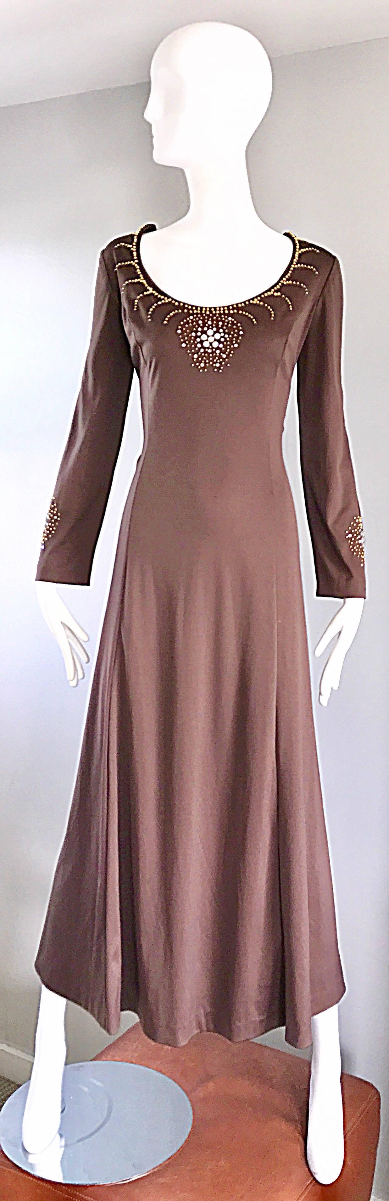 Gorgeous vintage 1970s light brown / coffee jersey long sleeve maxi dress! Gold beads and crystal rhinestones adorn the bust and bottom of each sleeve. Hidden metal zipper up the back with hook-and-eye closure. Looks amazing on, and can be worn