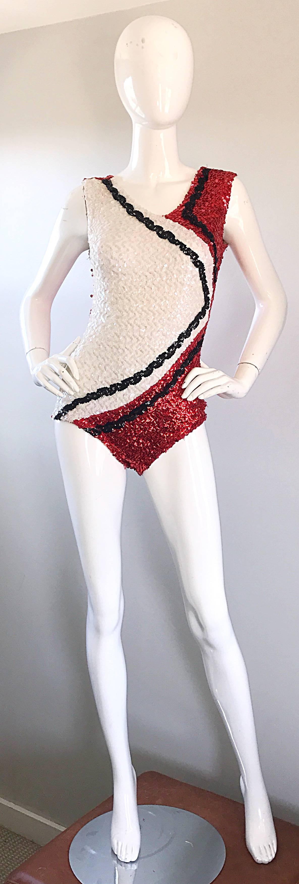 Fabulous super rare vintage 60s majorette knit sequined leotard romper! Features thousands of hand-sewn sequins throughout. Full metal zipper up the back. Great alone, or paired with shorts, jeans, trousers or a skirt. In great condition. Made in