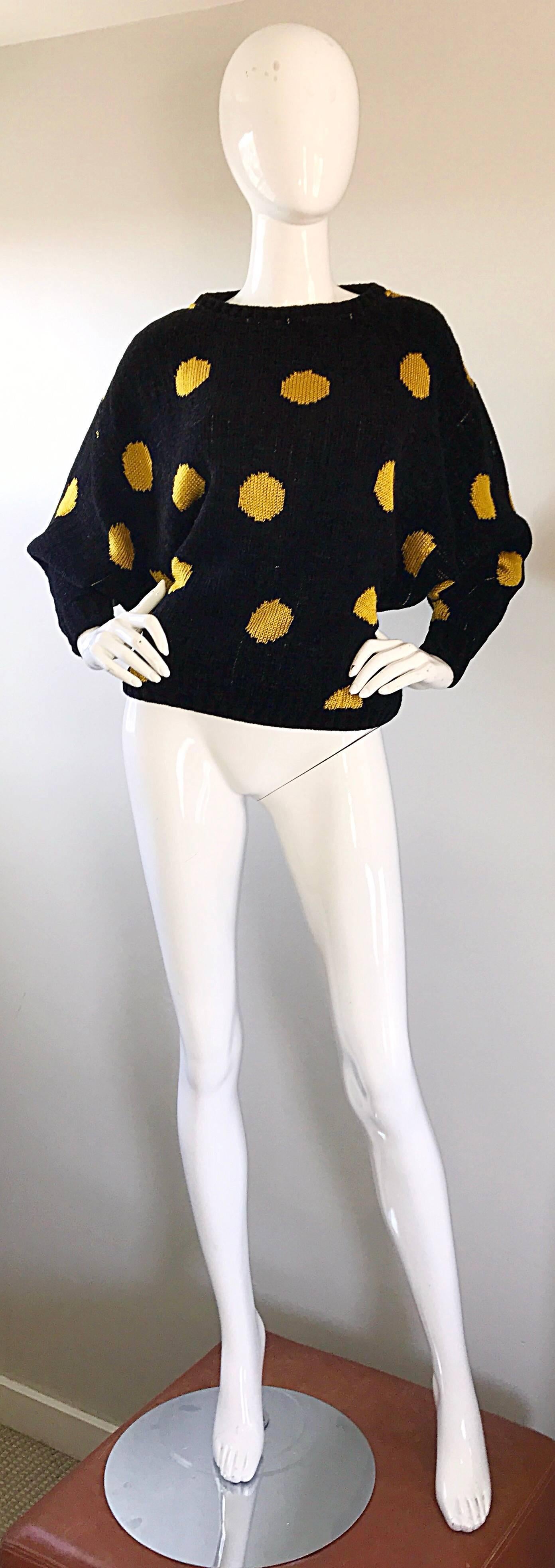 Fabulous and rare early 80s GIANNI VERSACE black and yellow polka dot intarsia sweater! From one of Versace's first collections in 1981. This fantastic piece of fashion history features a black background with yellow polka dots. Super soft chenille