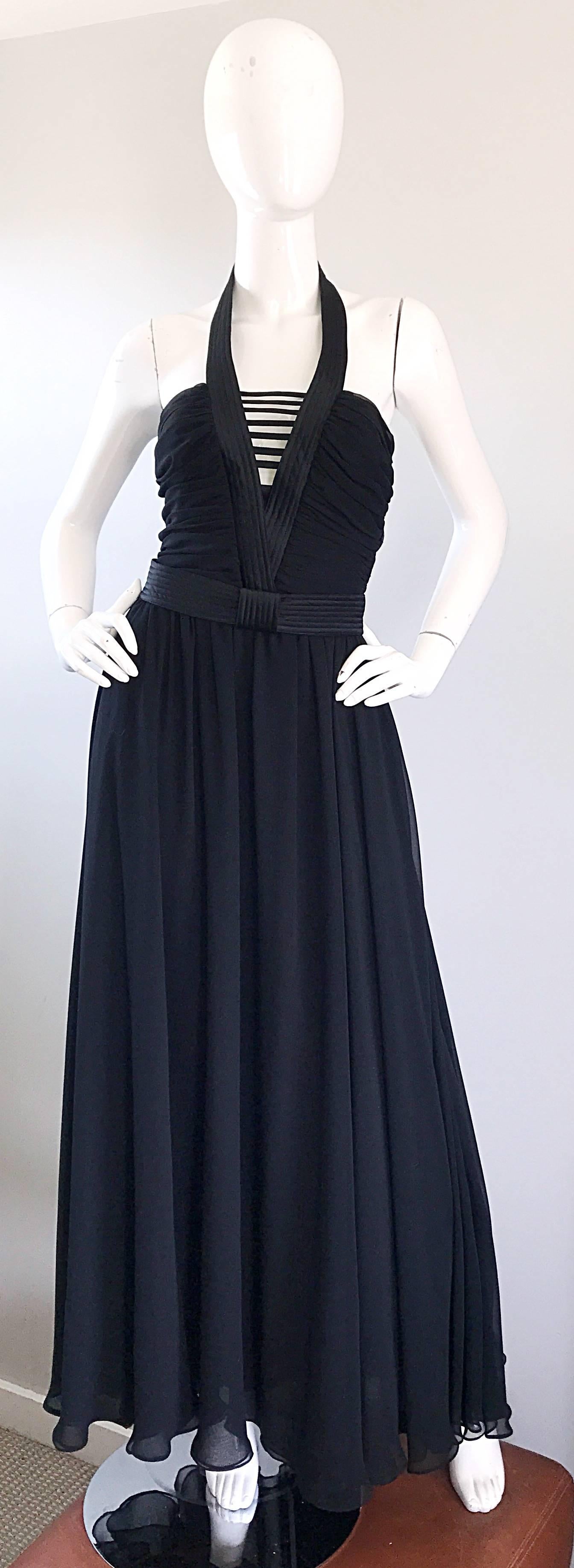 Sexy vintage late 70s FRANK USHER Of London black chiffon cut-out belted gown! Features cut-outs at bust and a detachable belt. Ribbed silk deep v-neck matches that of the belt. Hidden metal zipper up the back with hook-and-eye closure. A true