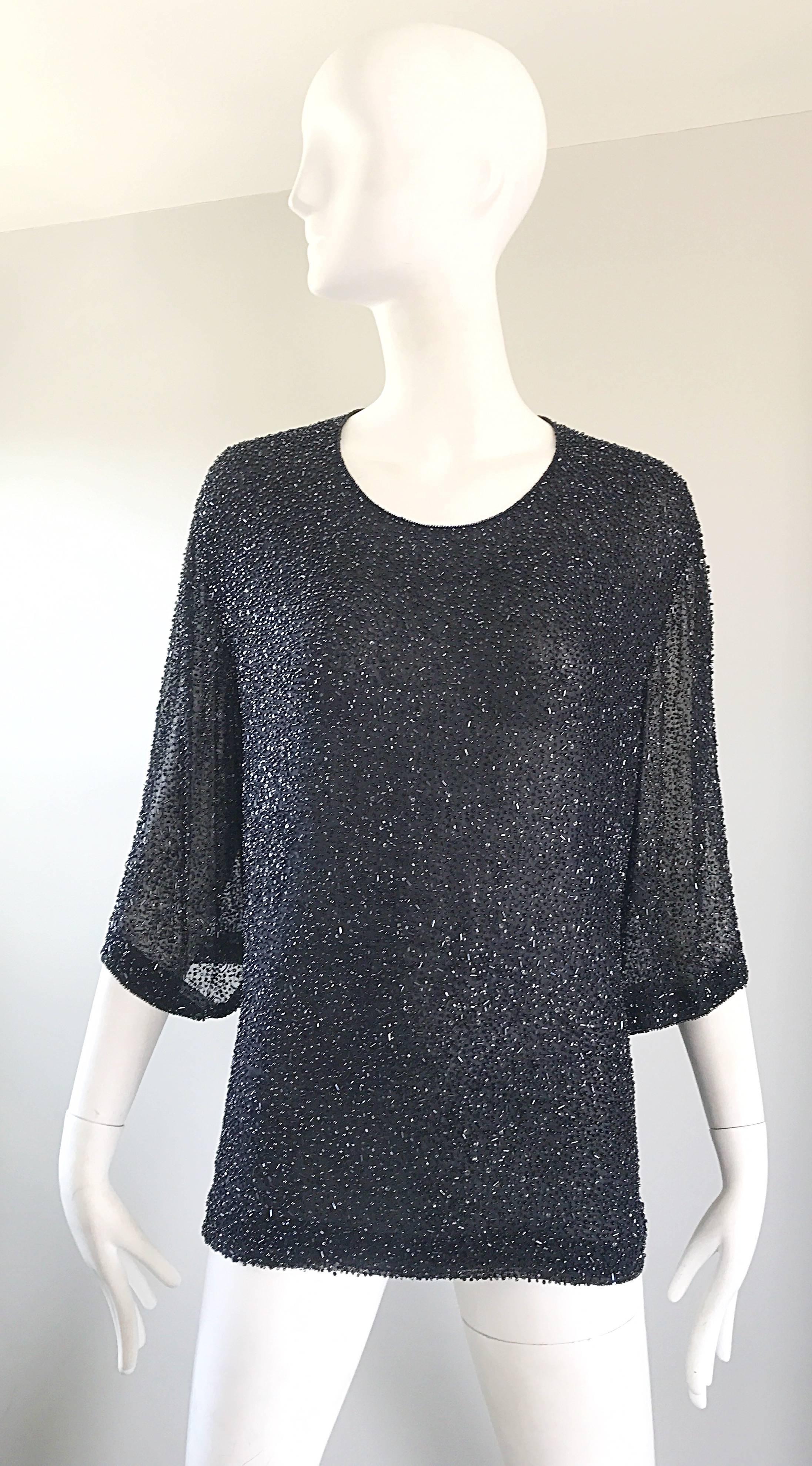 Fantastic plus size vintage BILL BLASS for SAKS 5th Ave. black silk chiffon beaded blouse! Features thousands of hand-sewn seed beads throughout the entire top. Silk covered black buttons up the back. Semi sheer 3/4 sleeves. Great belted or alone.