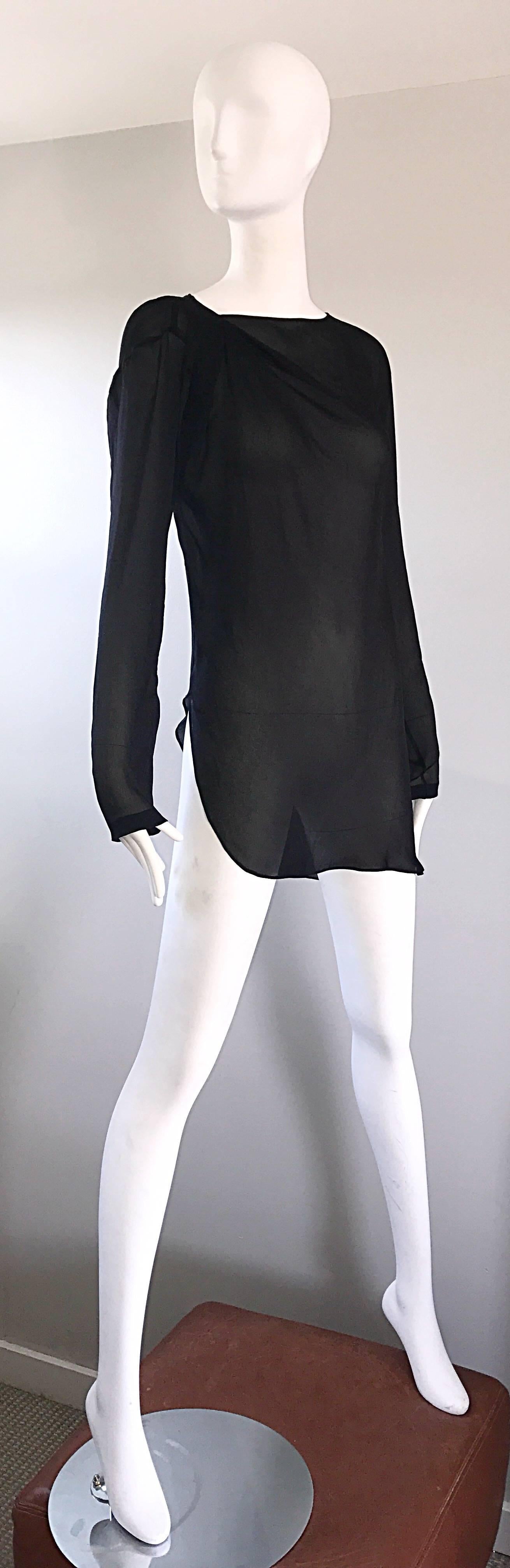 Wonderful vintage HALSTON black silk chiffon semi sheer asymmetrical long sleeve tunic top (NEW WITH ORIGINAL TAGS)! Intricate ruching detail at the neck. Asymmetrical hem is longer on the right side. Great with jeans or shorts, or perfect for the