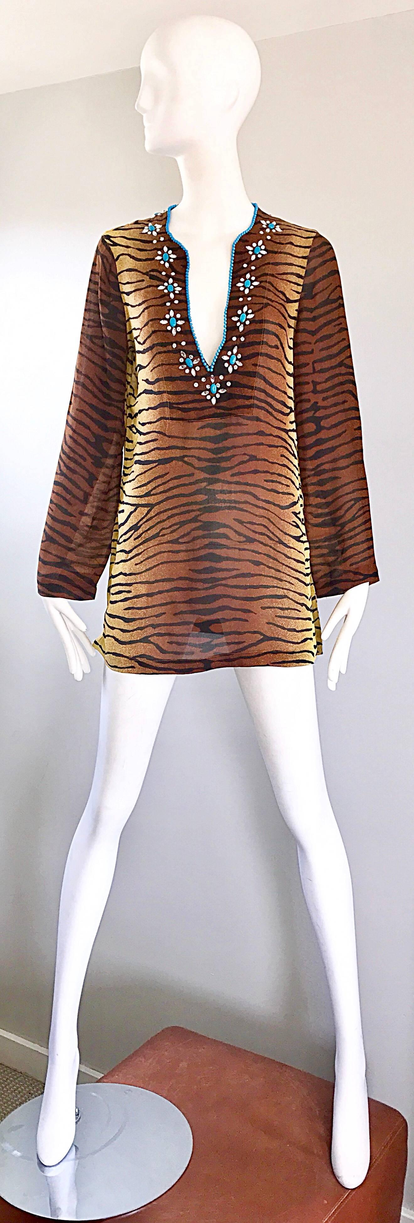 Beautiful vintage 90s MICHAEL KORS COLLECTION tiger / zebra print silk chiffon tunic blouse! Features hand-sewn turquoise blue beads and rhinestones around the v-neck. Features side vents on each side of the hem. Simply slips over the head. The