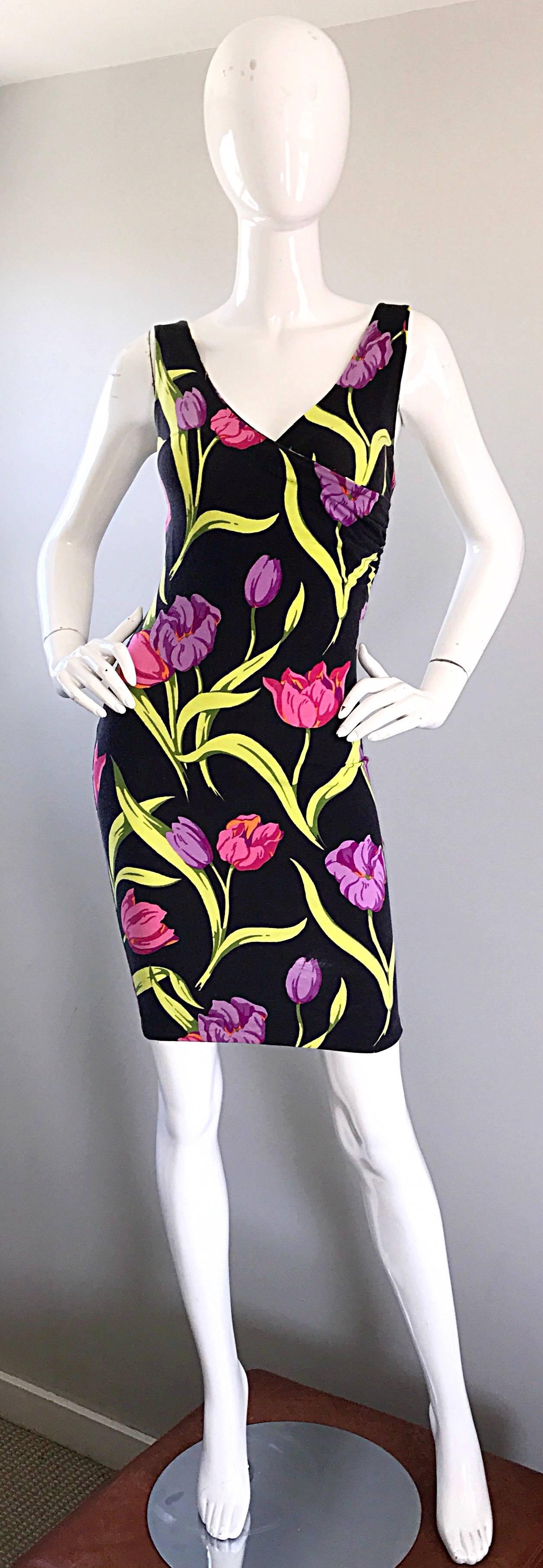 Sexy early vintage BETSEY JOHNSON 'Punk Label' bodcon dress! I have owned this dress once before, and it sold almost immediately! Vibrant hues of pink, green and purple on a black background. Tulip print thorughout. Crossover bust, with a flattering