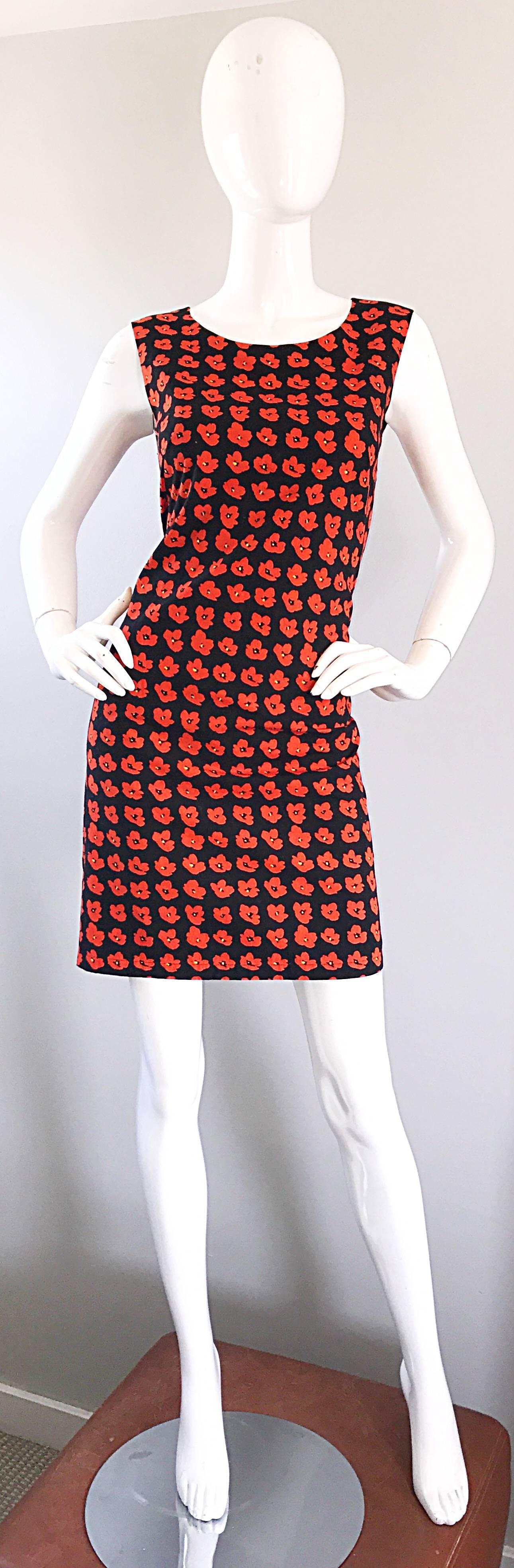 Chic vintage mid 1990s AGNES B three dimensional poppy print cotton French dress! Features red and yellow poppy flowers throughout, with a black background. Hidden zipper up the back with hook-and-eye closure. Fully lined. Can easily be dressed up
