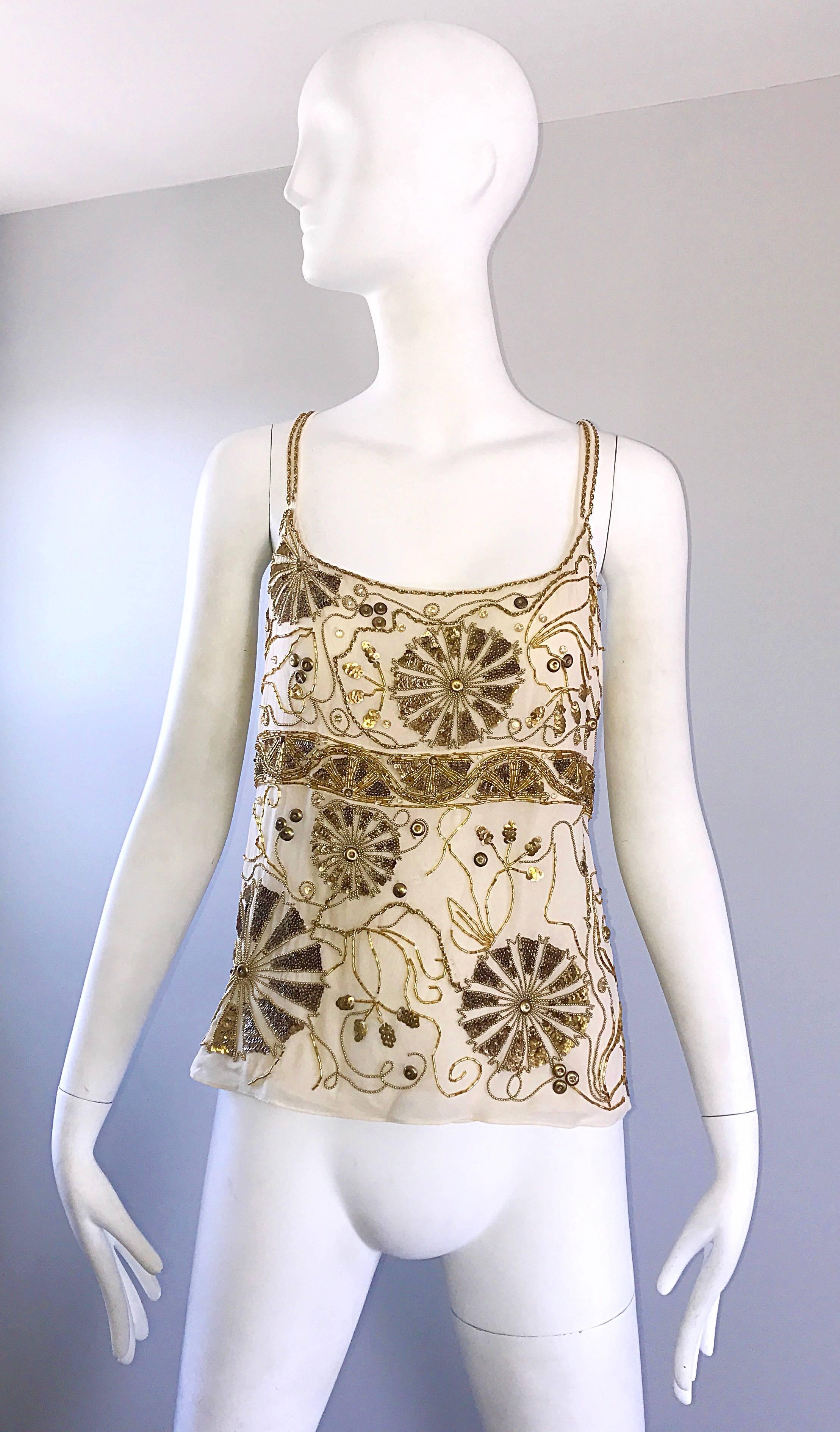 Beautiful vintage EMANUEL UNGARO plus size beige / ivory silk chiffon beaded sleeveless blouse! Features hundreds of hand-sewn sequins, beads and sequins throughout. Hidden zipper up the side. Can easily be dressed up or down. Great with shorts,