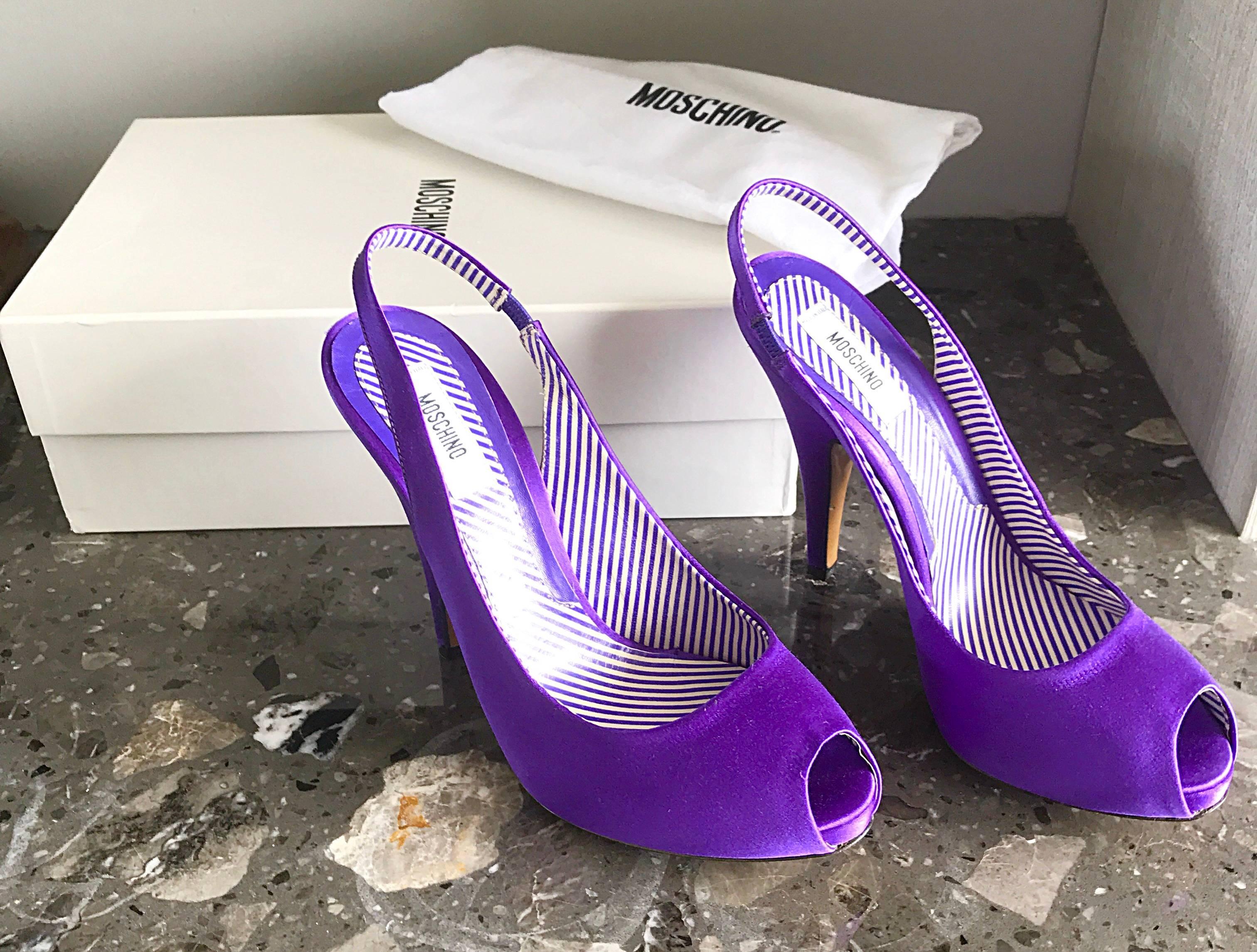Gorgeous brand new in box MOSCHINO peep toe sling back high heels! Features a regal purple color on luxurious silk satin. Hidden platform adds extra comfort. Leather sole, with side elastic bands at each back strap. Adds a pop of color to any
