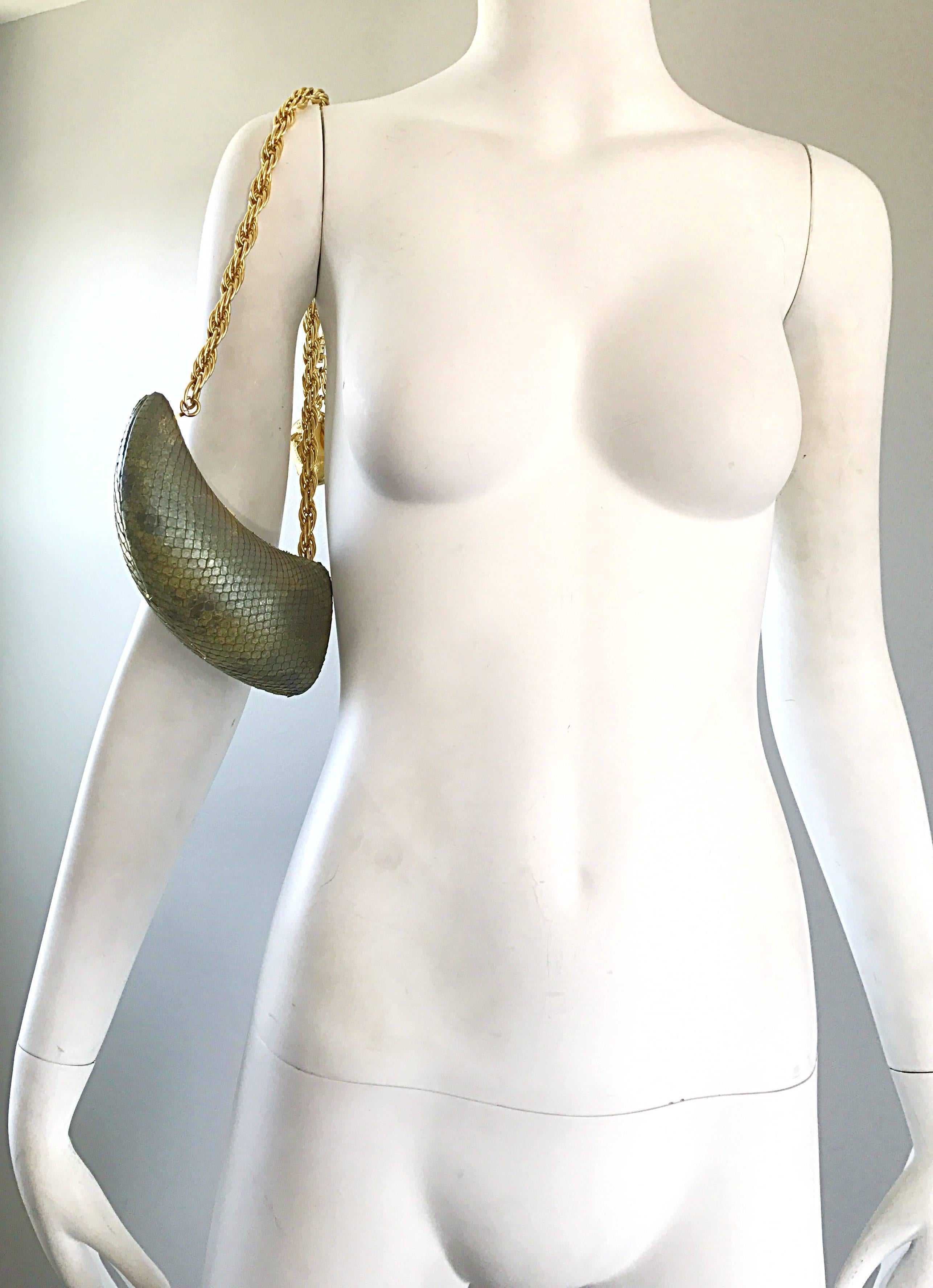 Chic avant garde snake skin horn shaped shoulder evening bag! Snakeskin with a slight iridescent sheen that resembles fish scales / mermaid. Sturdy gold chain, with just the right amount of drop to sit comfortably on the shoulder. Removable gold