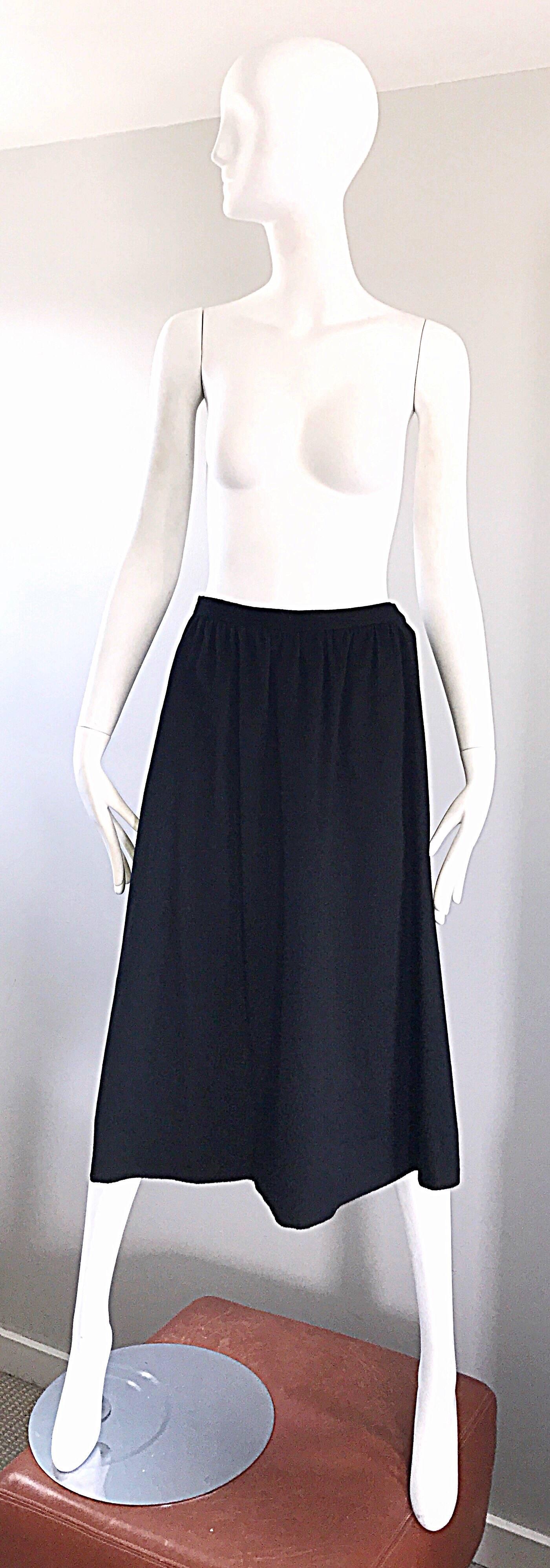 Chic and timeless vintage 70s YVES SAINT LAURENT ' Rive Gauche ' RUSSIAN COLLECTION soft black wool midi A - Line skirt! Features the softest wool, and is fully lined. Hidden metal zipper up the side with hidden large hook-and-eye closure. Intricate